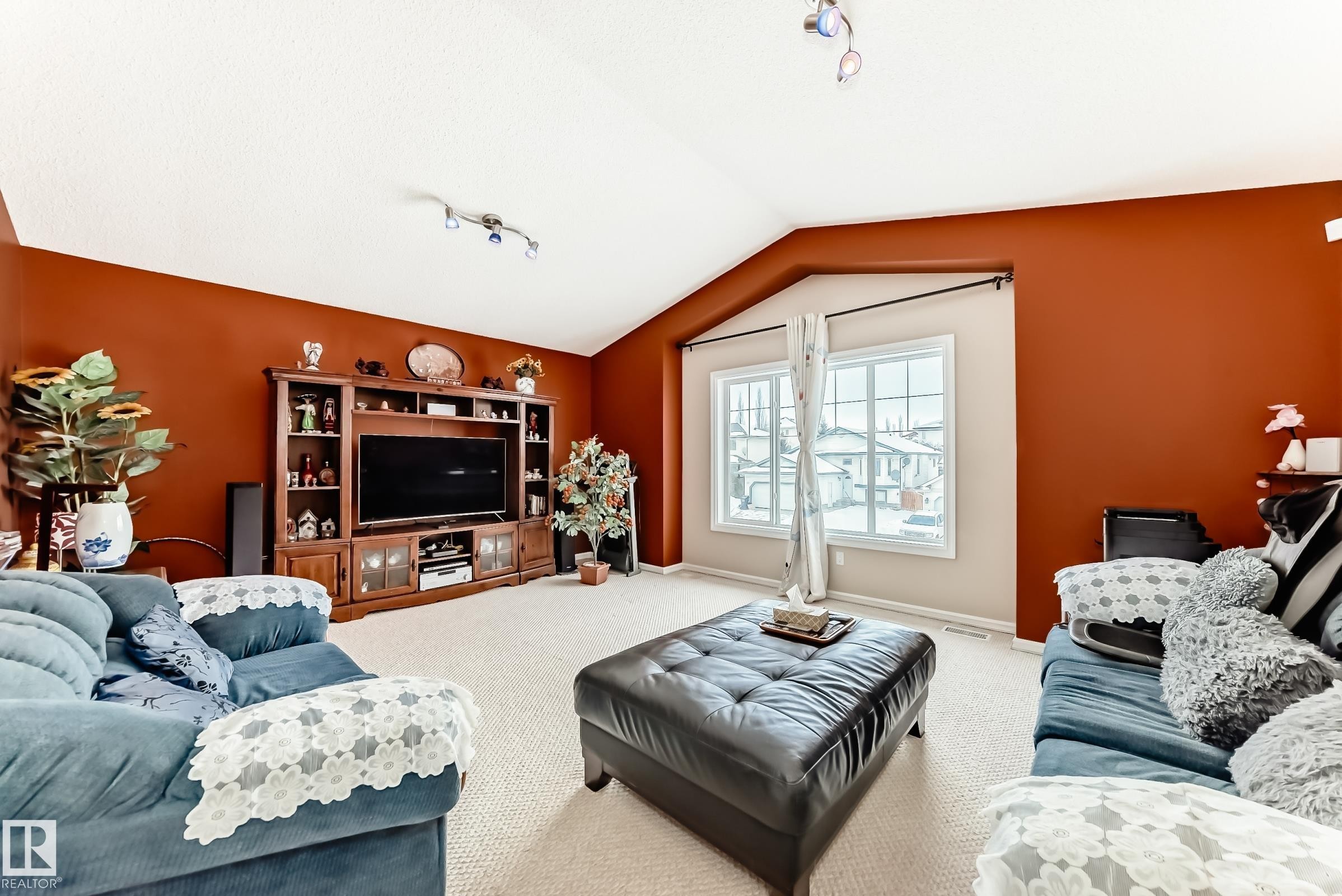 Living room with rail lighting and carpet - 4619 151 Avenue, Edmonton, AB - Indoor Photo Showing Living Room