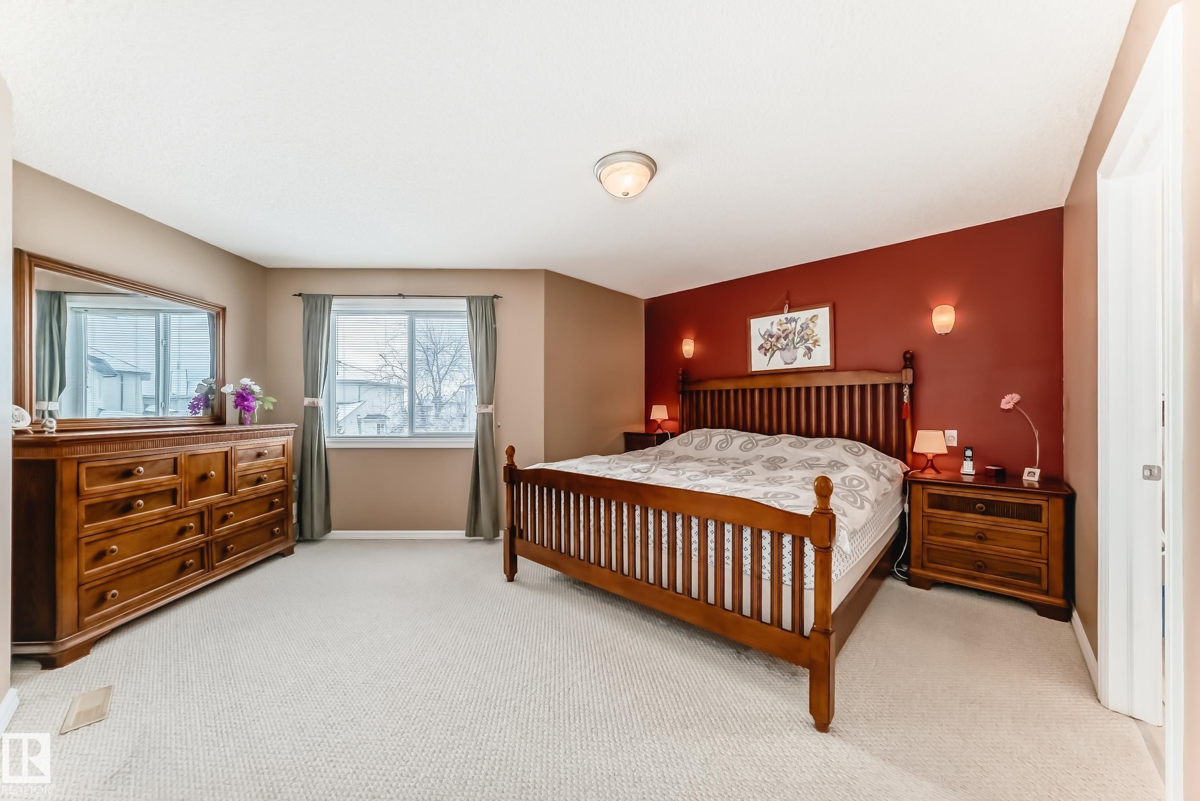 Bedroom featuring light carpet and baseboards - 4619 151 Avenue, Edmonton, AB - Indoor Photo Showing Bedroom