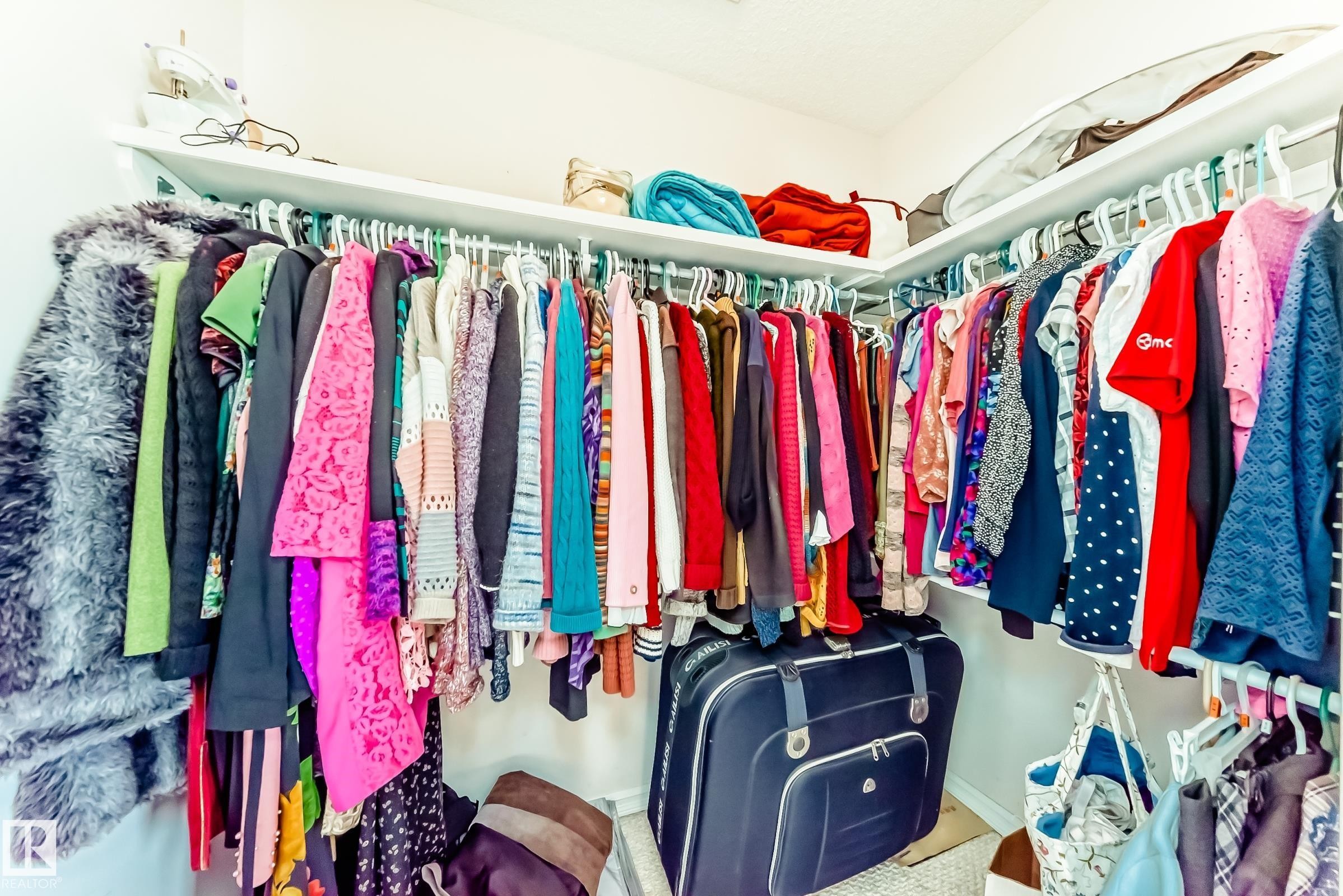 View of walk in closet - 4619 151 Avenue, Edmonton, AB - Indoor With Storage