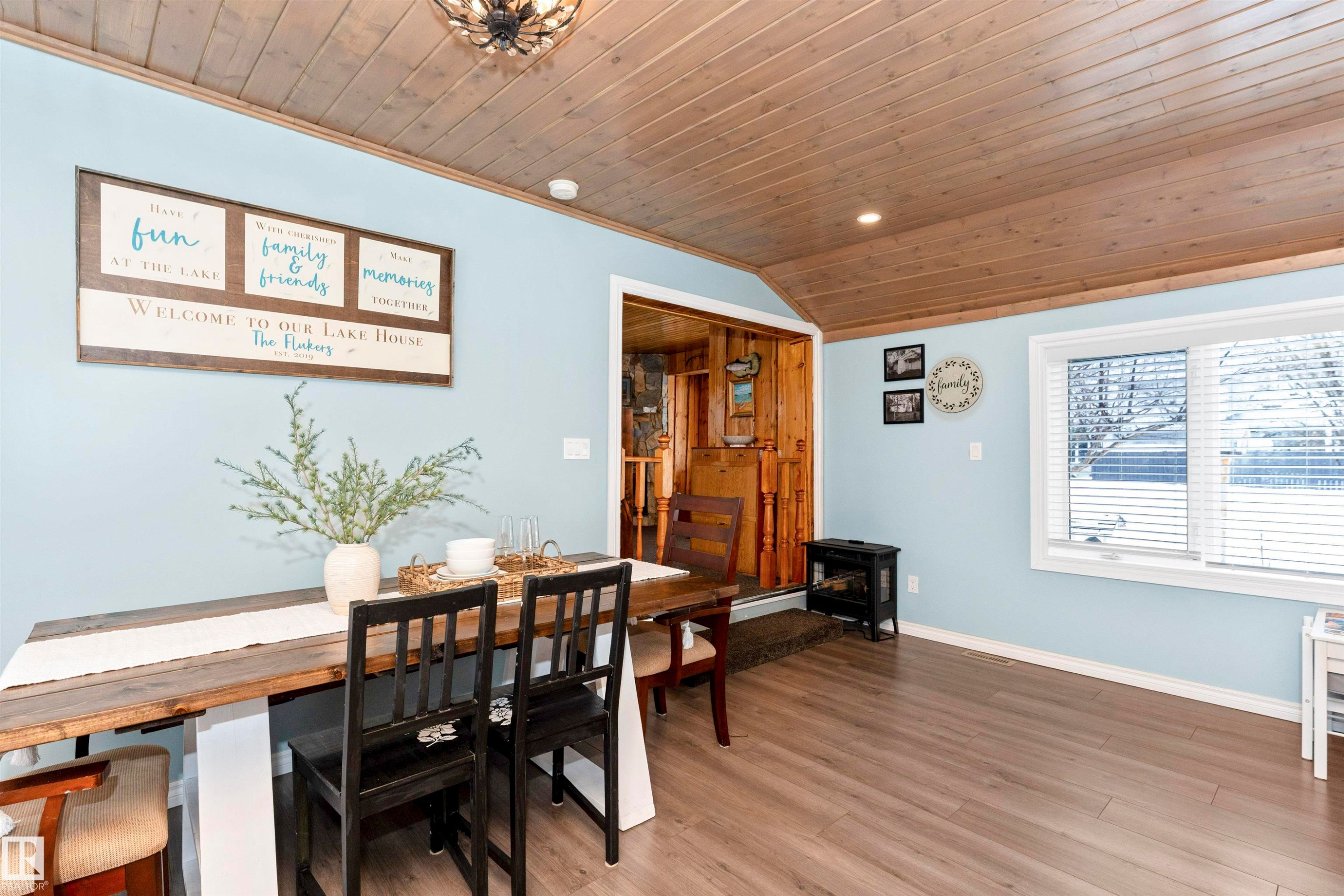 Dining room with plenty of natural light, wood ceiling, light wood-style floors, and suspended lighting - 516 5 Street, Rural Lac Ste. Anne County, AB - Indoor Photo Showing Dining Room