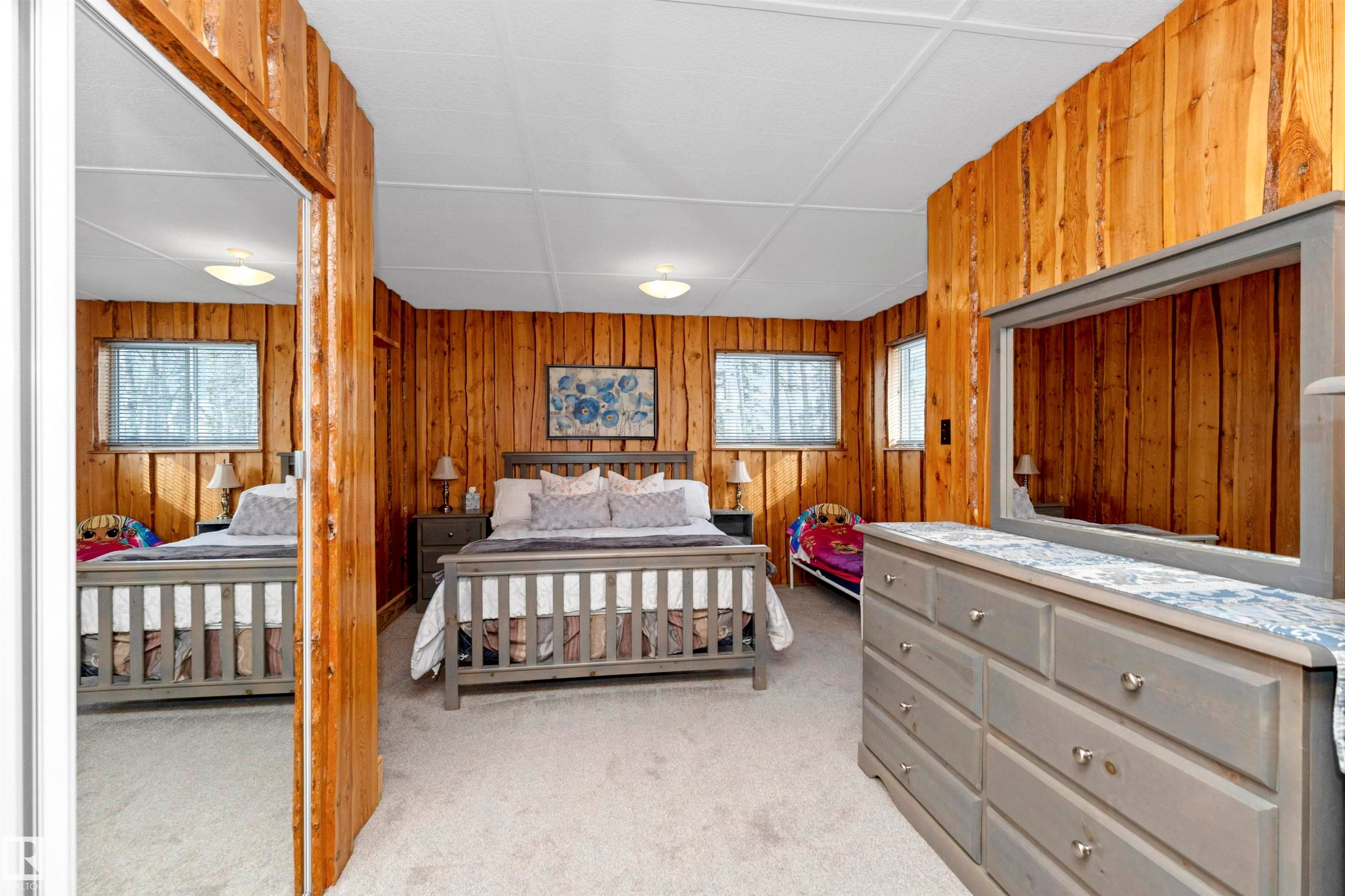 Bathroom with a shower with curtain, wooden ceiling, light tile patterned floors, and wooden walls - 516 5 Street, Rural Lac Ste. Anne County, AB - Indoor Photo Showing Bathroom
