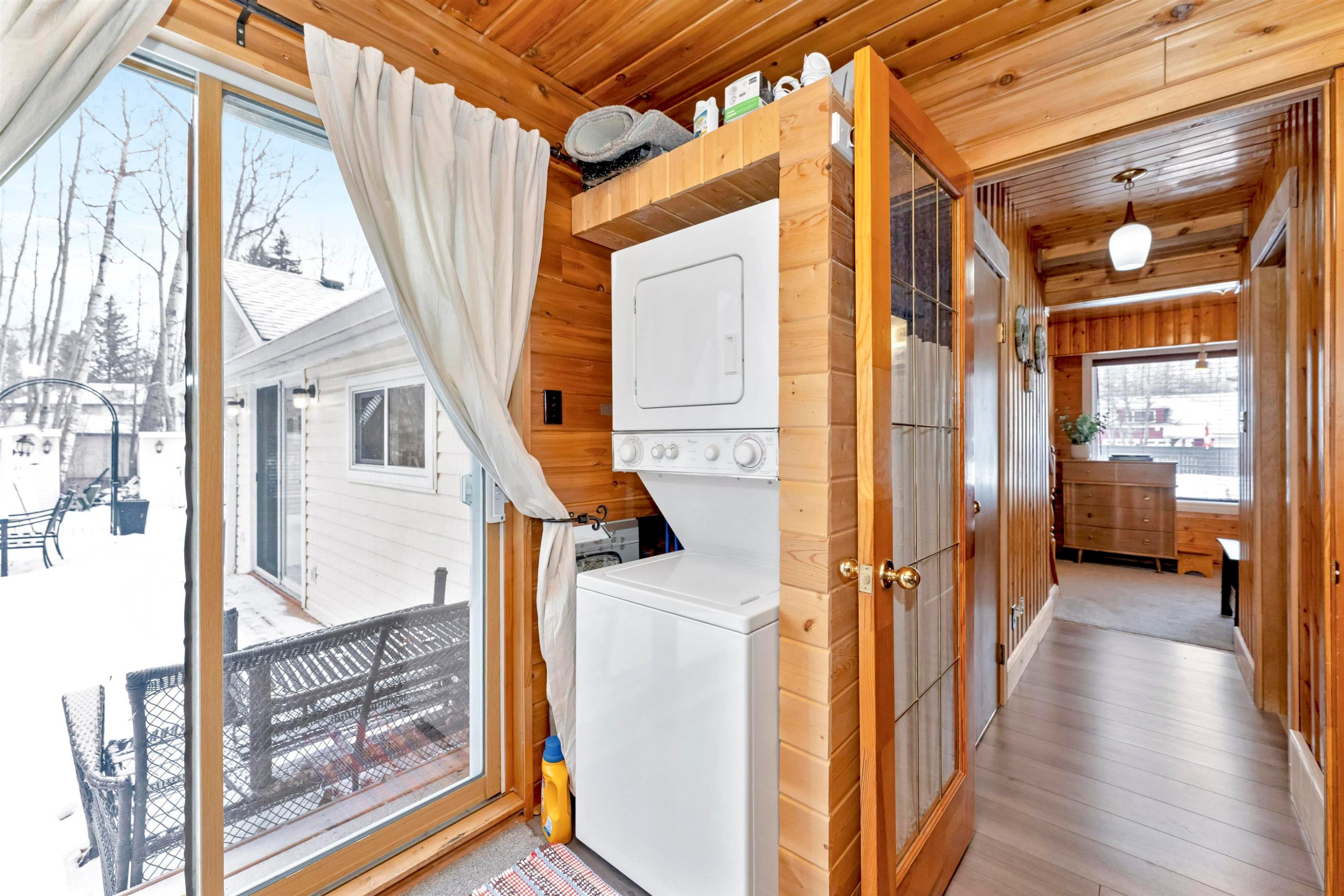 Dock area with boat lift, a water view, and a yard - 516 5 Street, Rural Lac Ste. Anne County, AB - Outdoor With Body Of Water With View