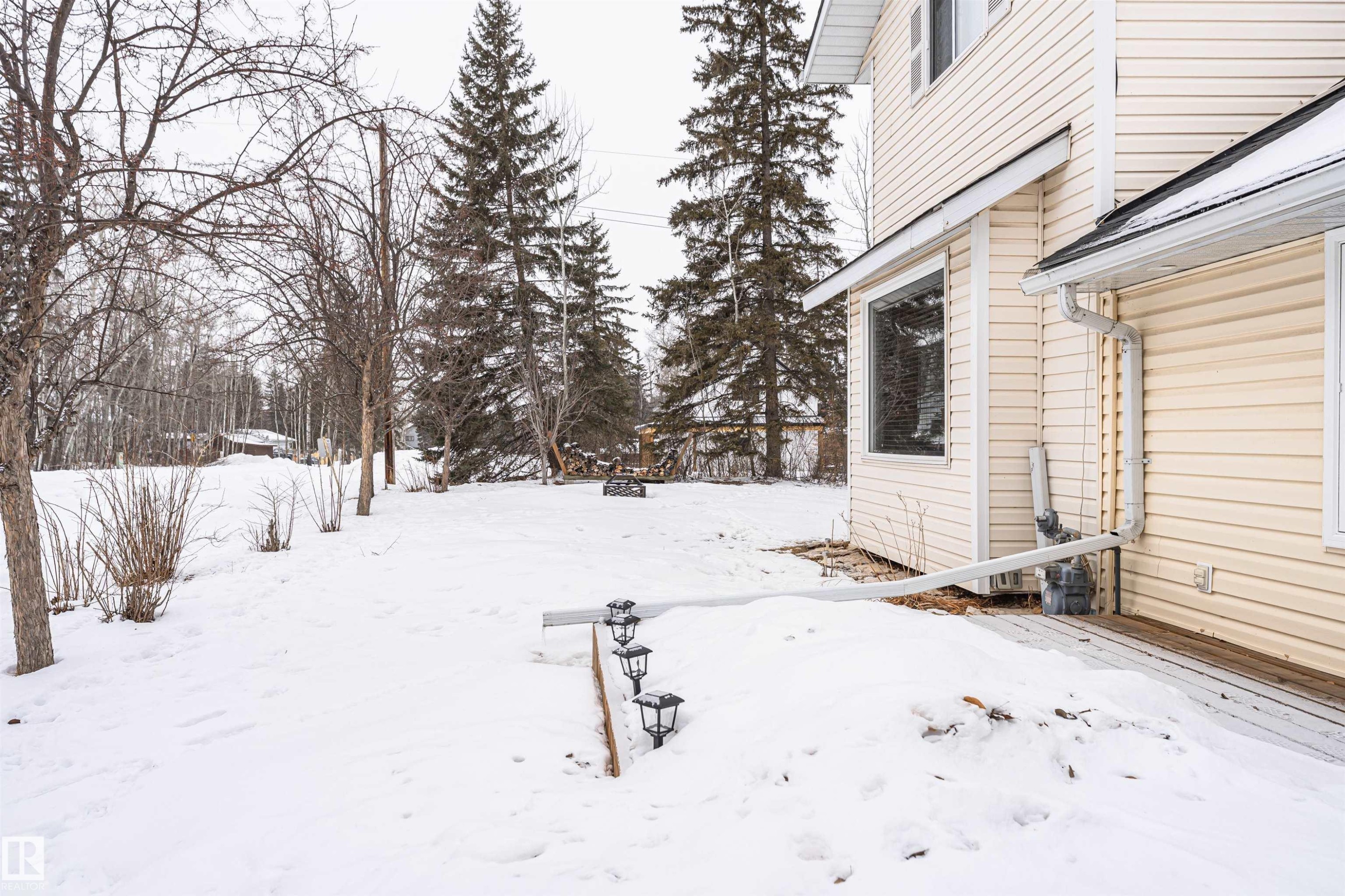 View of yard layered in snow - 516 5 Street, Rural Lac Ste. Anne County, AB - Outdoor