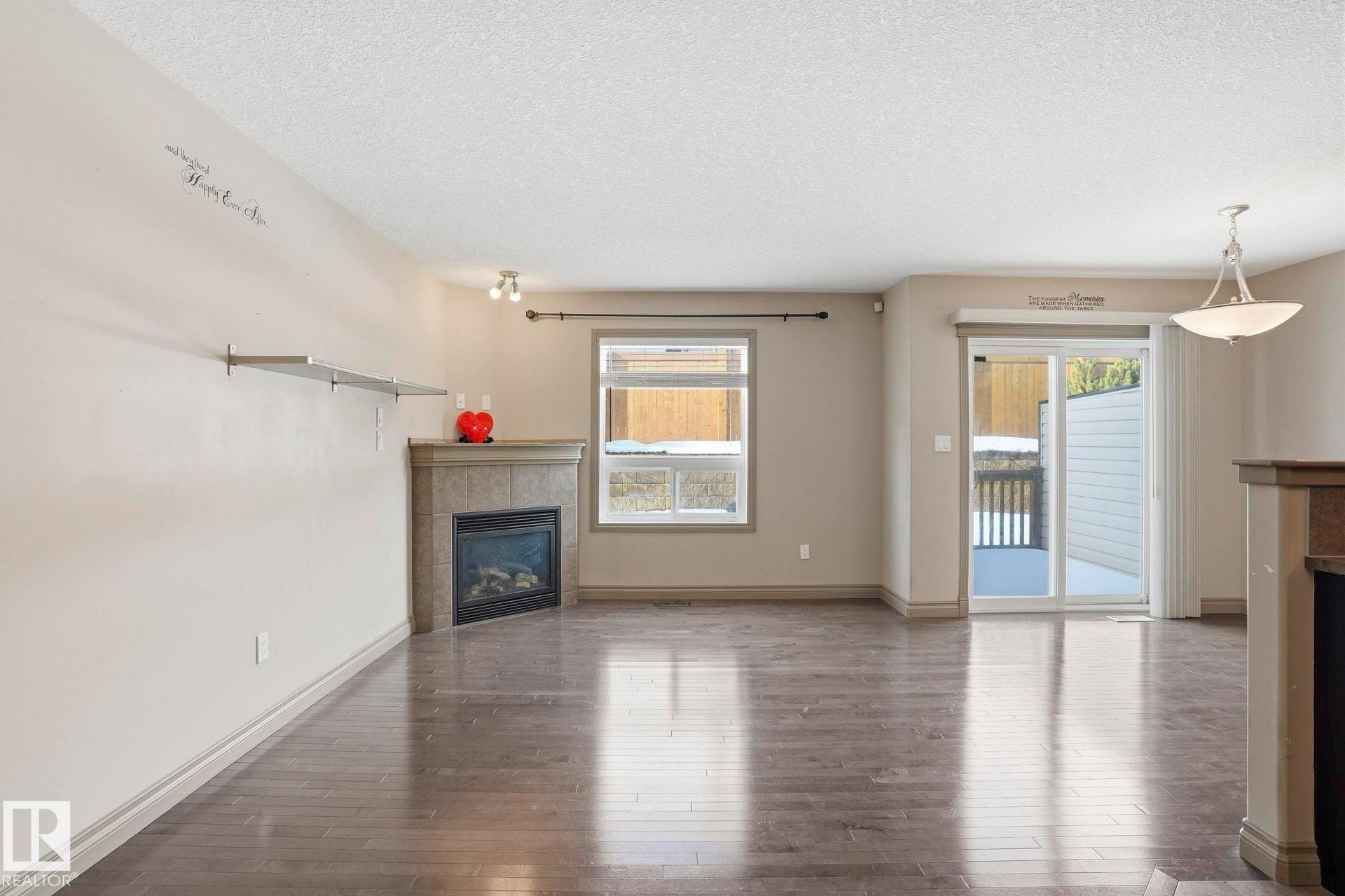 21 5120 164 Avenue, Edmonton, AB - Indoor Photo Showing Living Room With Fireplace