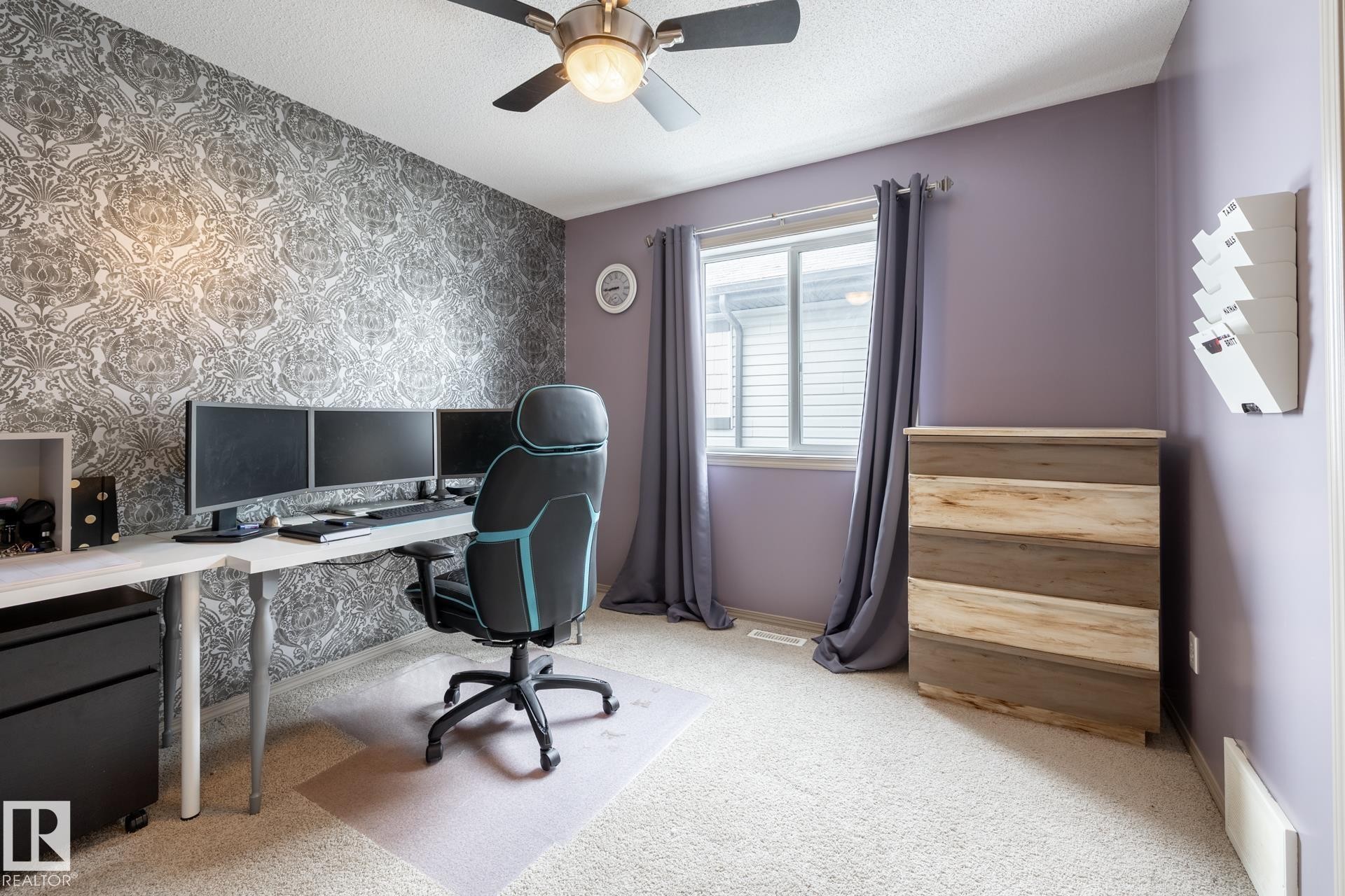 Office area with wallpapered walls, an accent wall, ceiling fan, light carpet, and a textured ceiling - 3312 17B Avenue, Edmonton, AB - Indoor Photo Showing Office