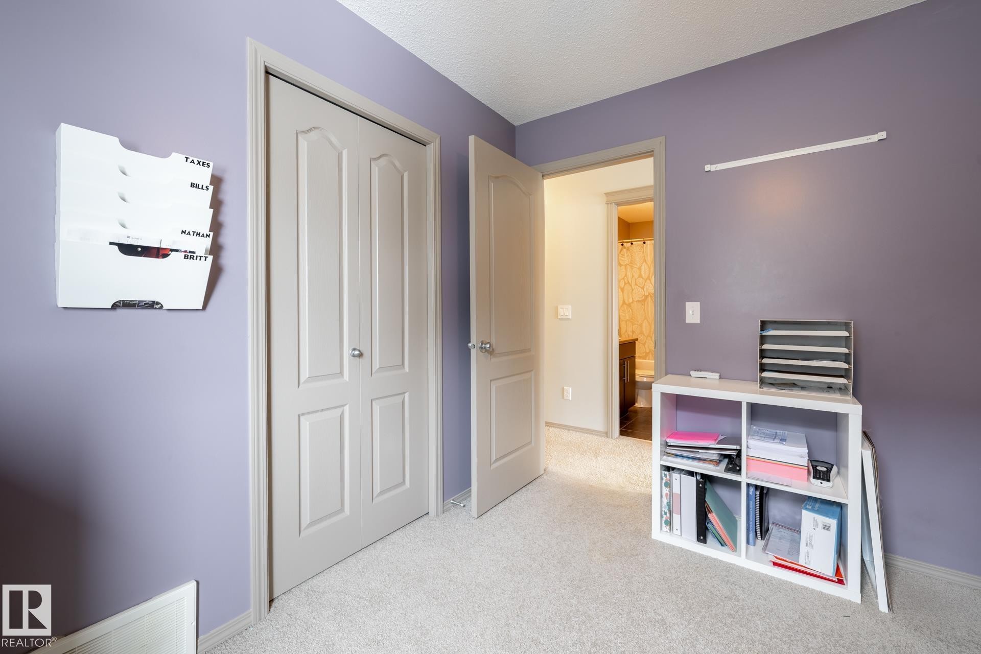 Rec room with light carpet and a textured ceiling - 3312 17B Avenue, Edmonton, AB - Indoor