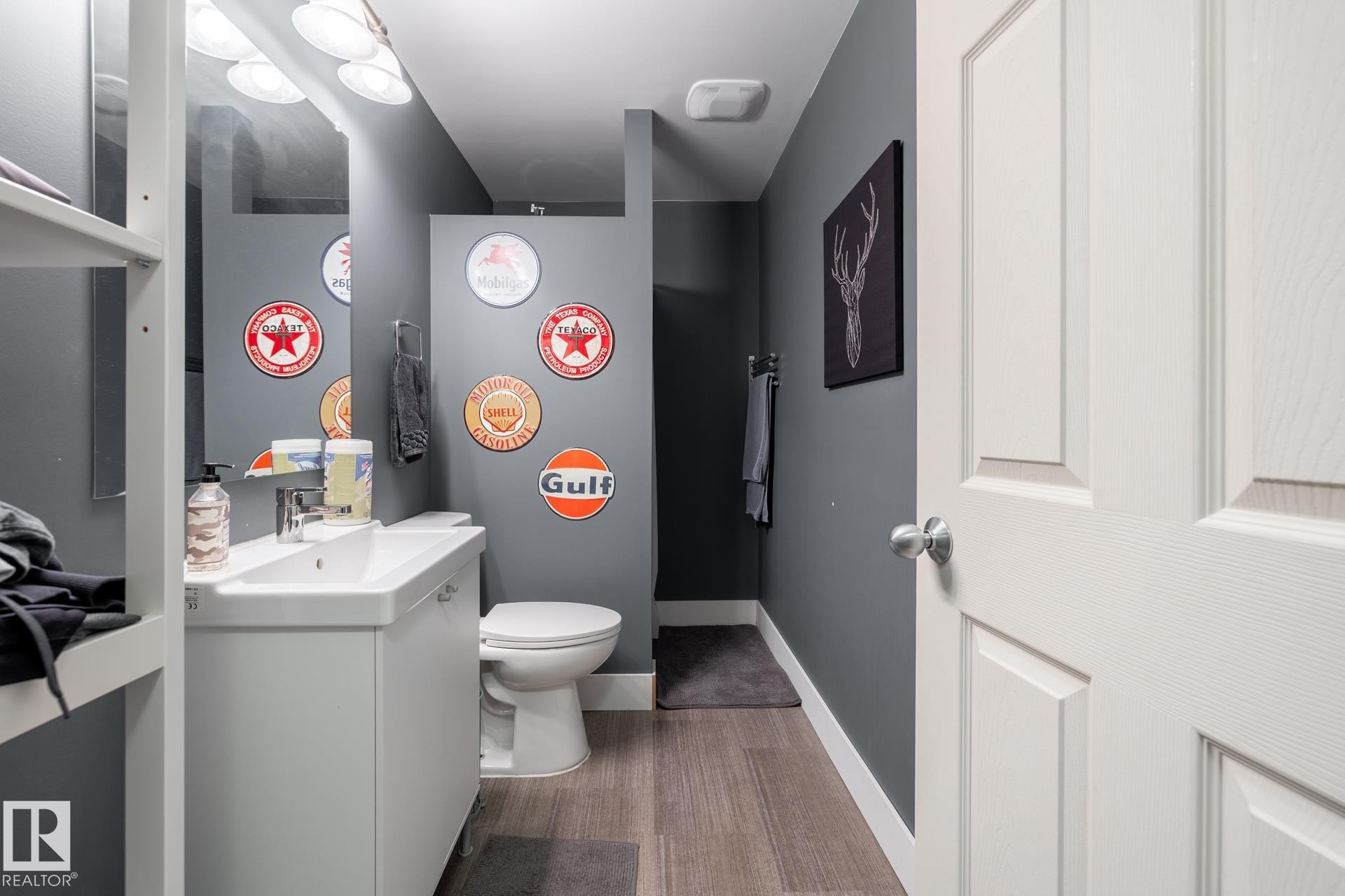 Bathroom with vanity and light wood-style floors - 3312 17B Avenue, Edmonton, AB - Indoor Photo Showing Laundry Room