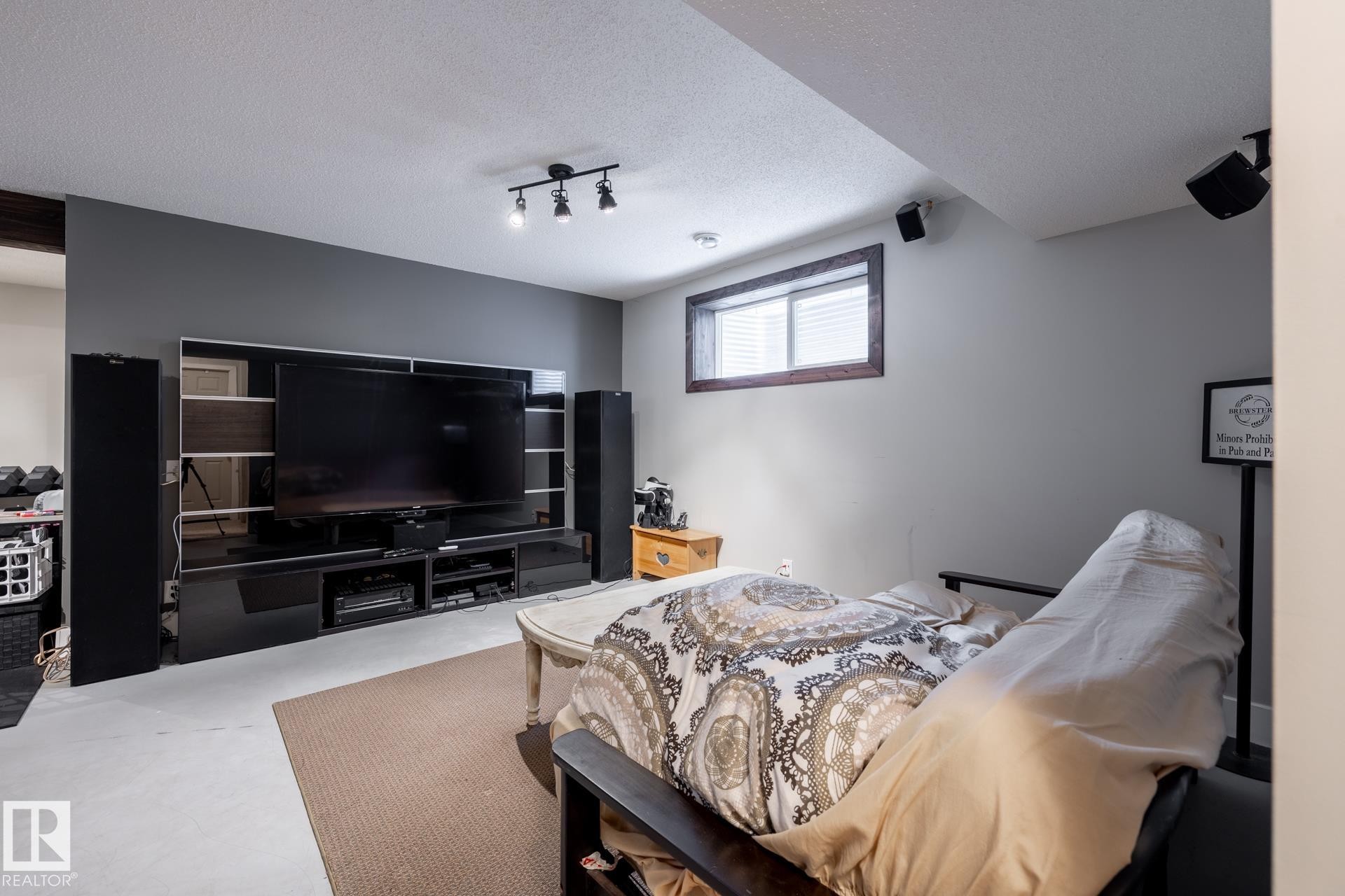 Bedroom with a textured ceiling and track lighting - 3312 17B Avenue, Edmonton, AB - Indoor Photo Showing Bedroom