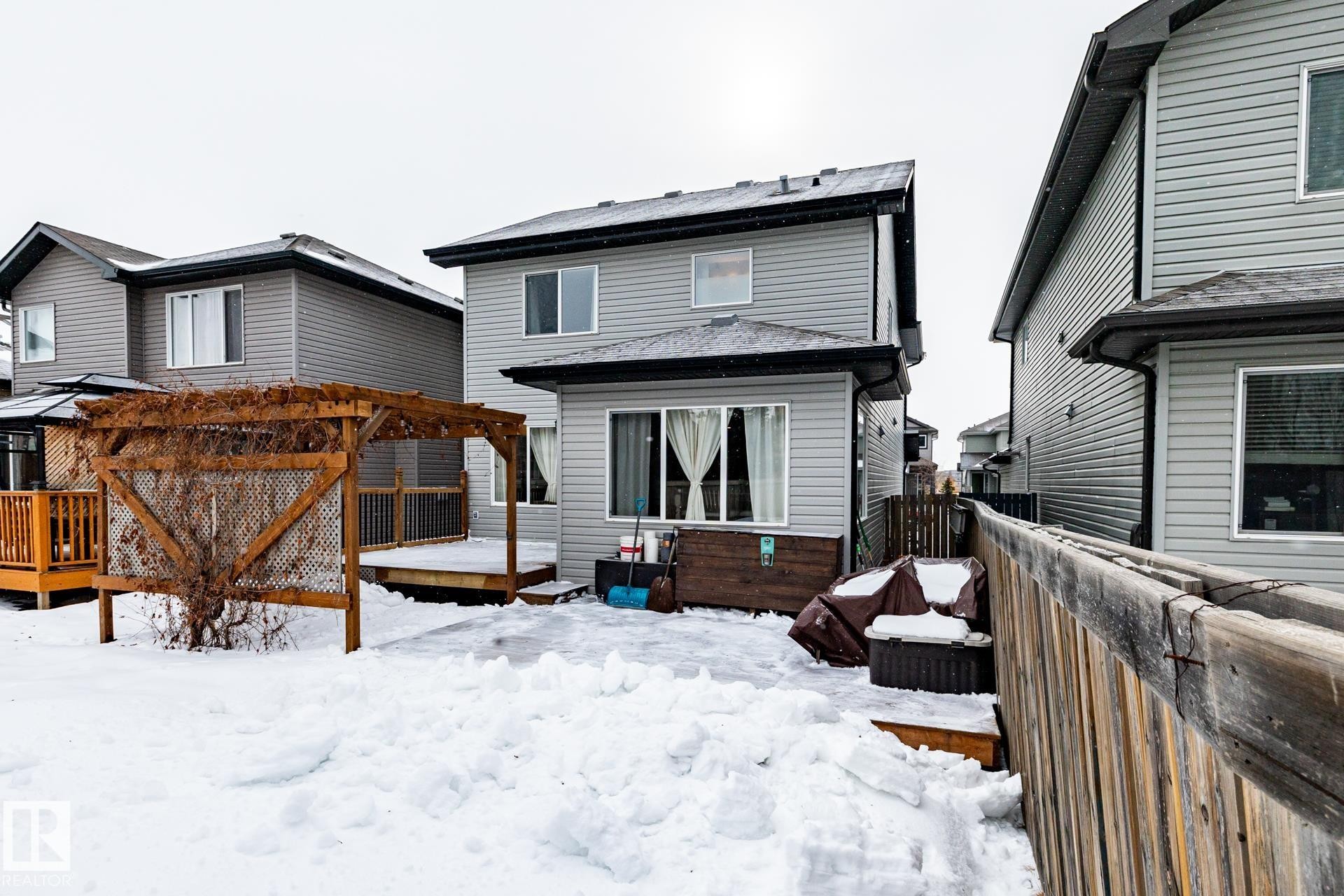 Back of property with a wooden deck - 3312 17B Avenue, Edmonton, AB - Outdoor With Deck Patio Veranda With Exterior