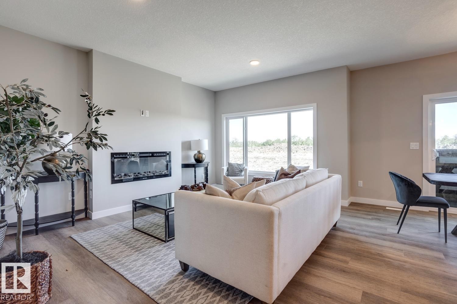 407 Brickyard Point(E), Stony Plain, AB - Indoor Photo Showing Living Room With Fireplace