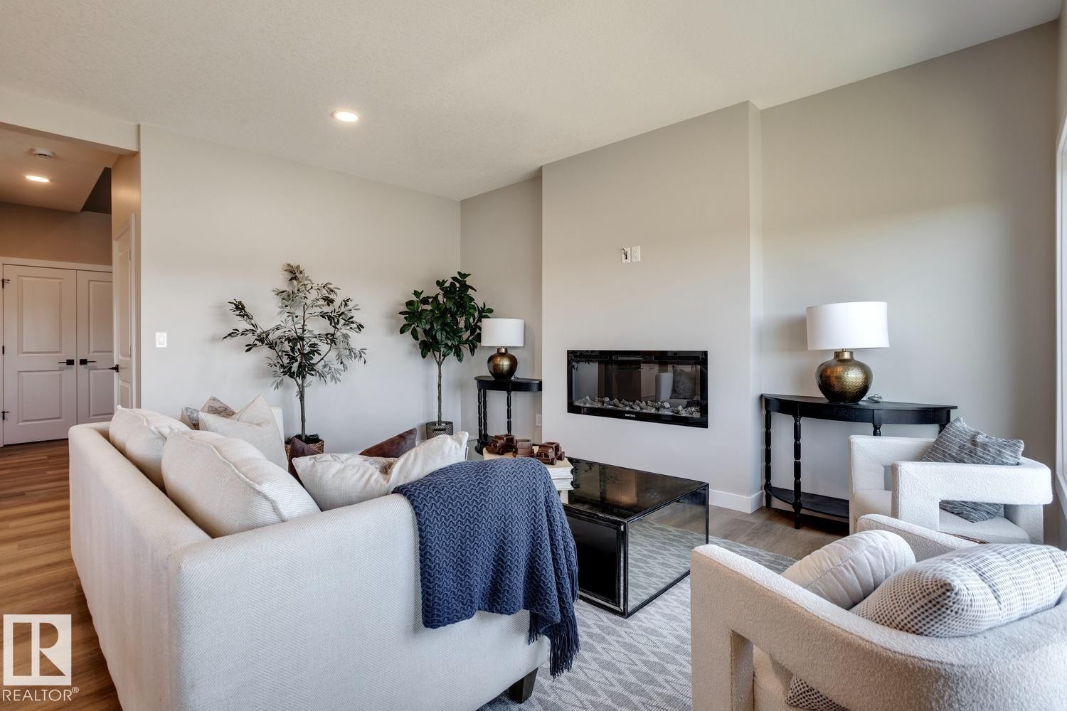 407 Brickyard Point(E), Stony Plain, AB - Indoor Photo Showing Living Room With Fireplace