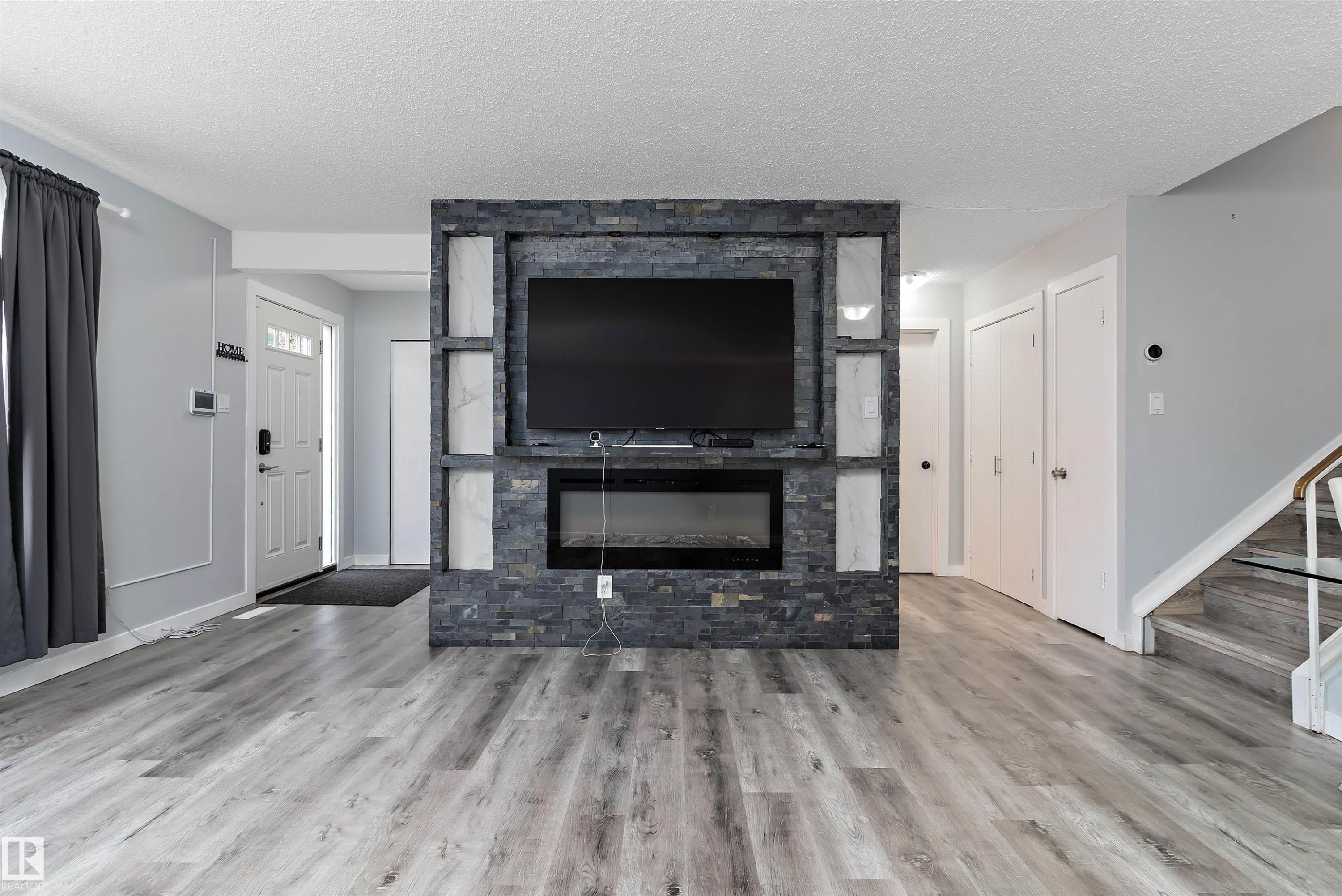 3214 71 Street, Edmonton, AB - Indoor Photo Showing Living Room With Fireplace