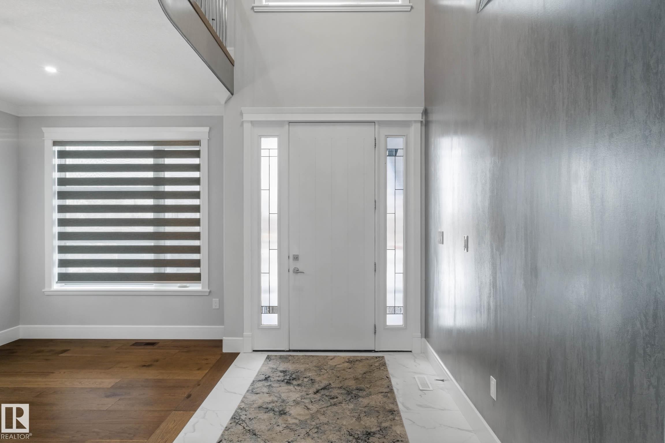 Entryway featuring baseboards and light marble finish floors - 4086 Whispering River Drive, Edmonton, AB - Indoor Photo Showing Other Room