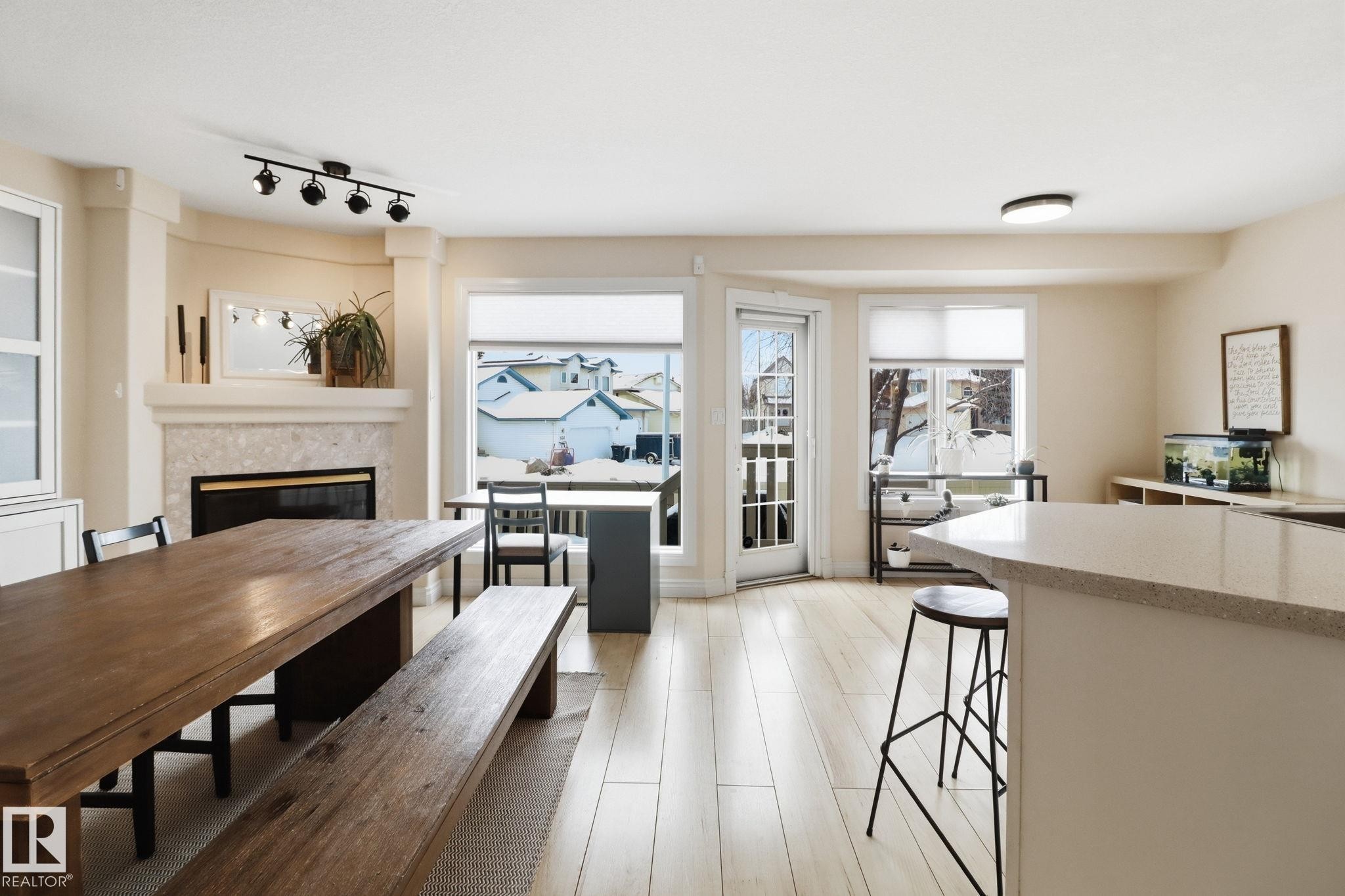 38 882 Ryan Place, Edmonton, AB - Indoor Photo Showing Dining Room With Fireplace