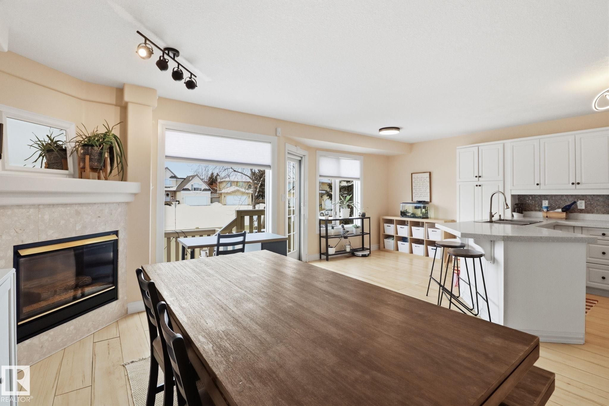 38 882 Ryan Place, Edmonton, AB - Indoor Photo Showing Kitchen With Fireplace