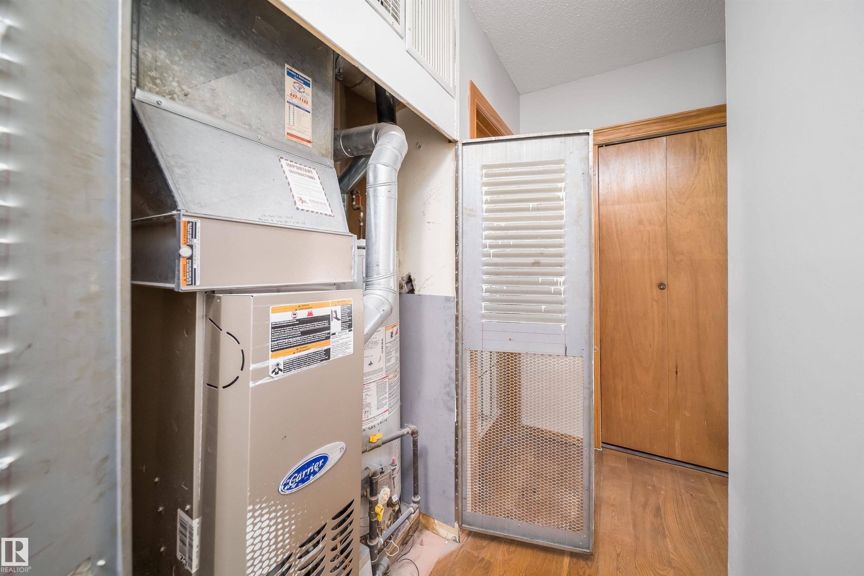Utilities featuring heating unit - 8908 130 Avenue Nw, Edmonton, AB - Indoor Photo Showing Basement