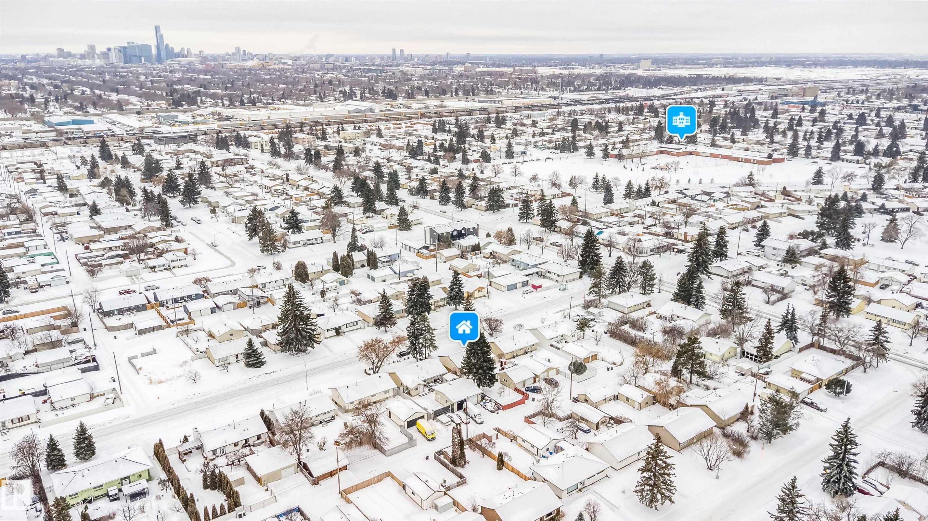 Snowy aerial view featuring a view of city - 8908 130 Avenue Nw, Edmonton, AB - Outdoor With View
