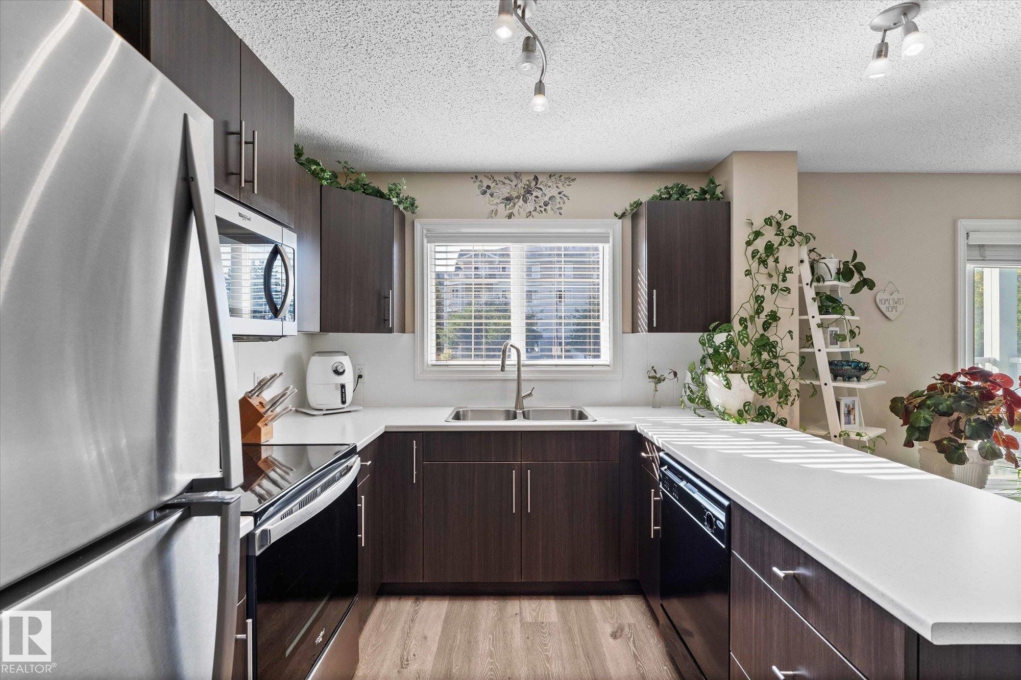 112 2208 44 Avenue, Edmonton, AB - Indoor Photo Showing Kitchen With Double Sink