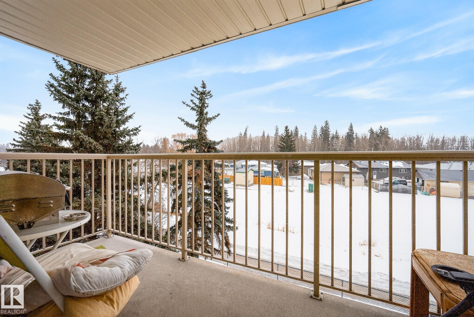 View of snow covered back of property - 302 4608 52 Avenue, Stony Plain, AB - Outdoor With Balcony With Exterior