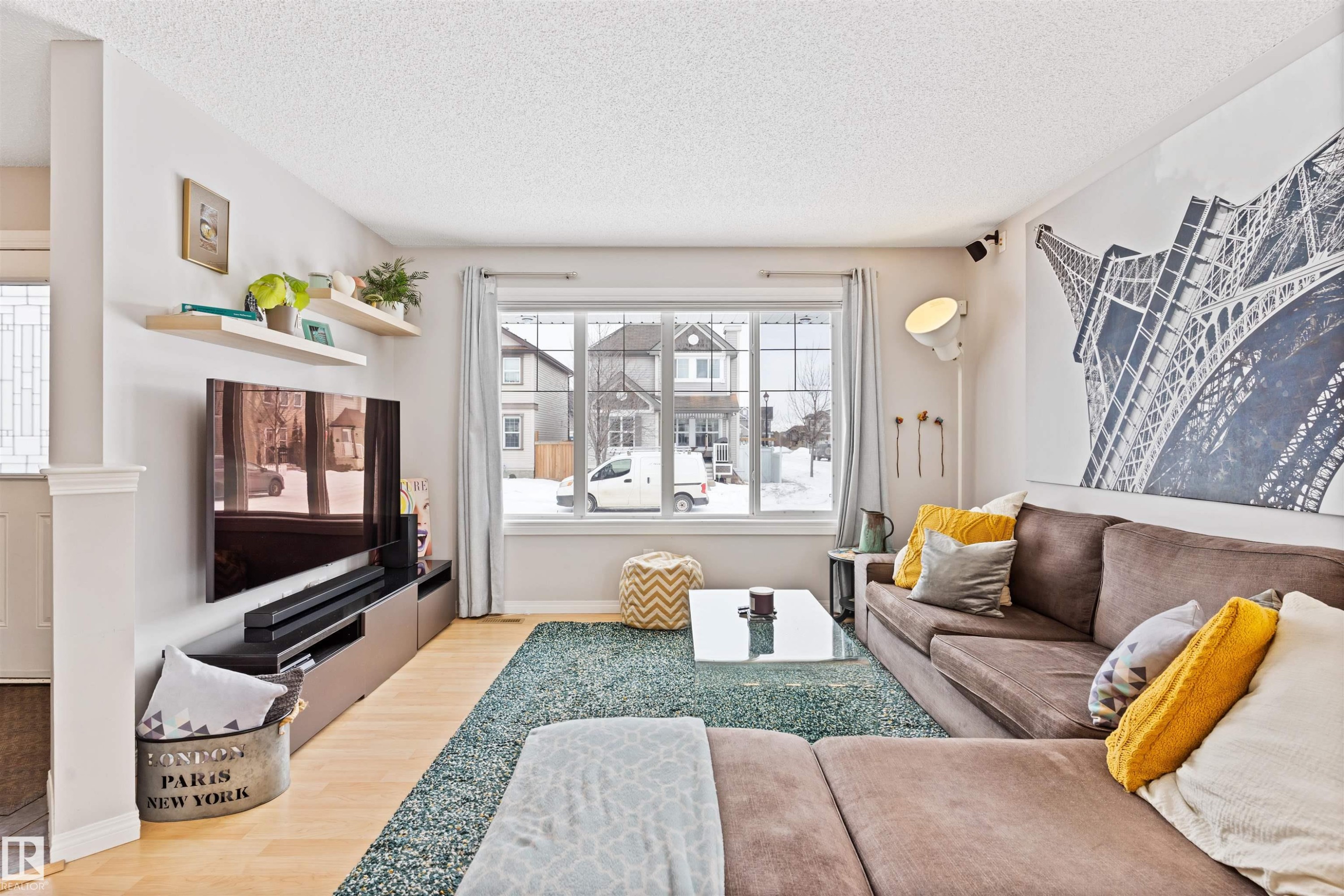 Living area with light wood-type flooring and a textured ceiling - 7804 Schmid Place, Edmonton, AB - Indoor Photo Showing Bedroom