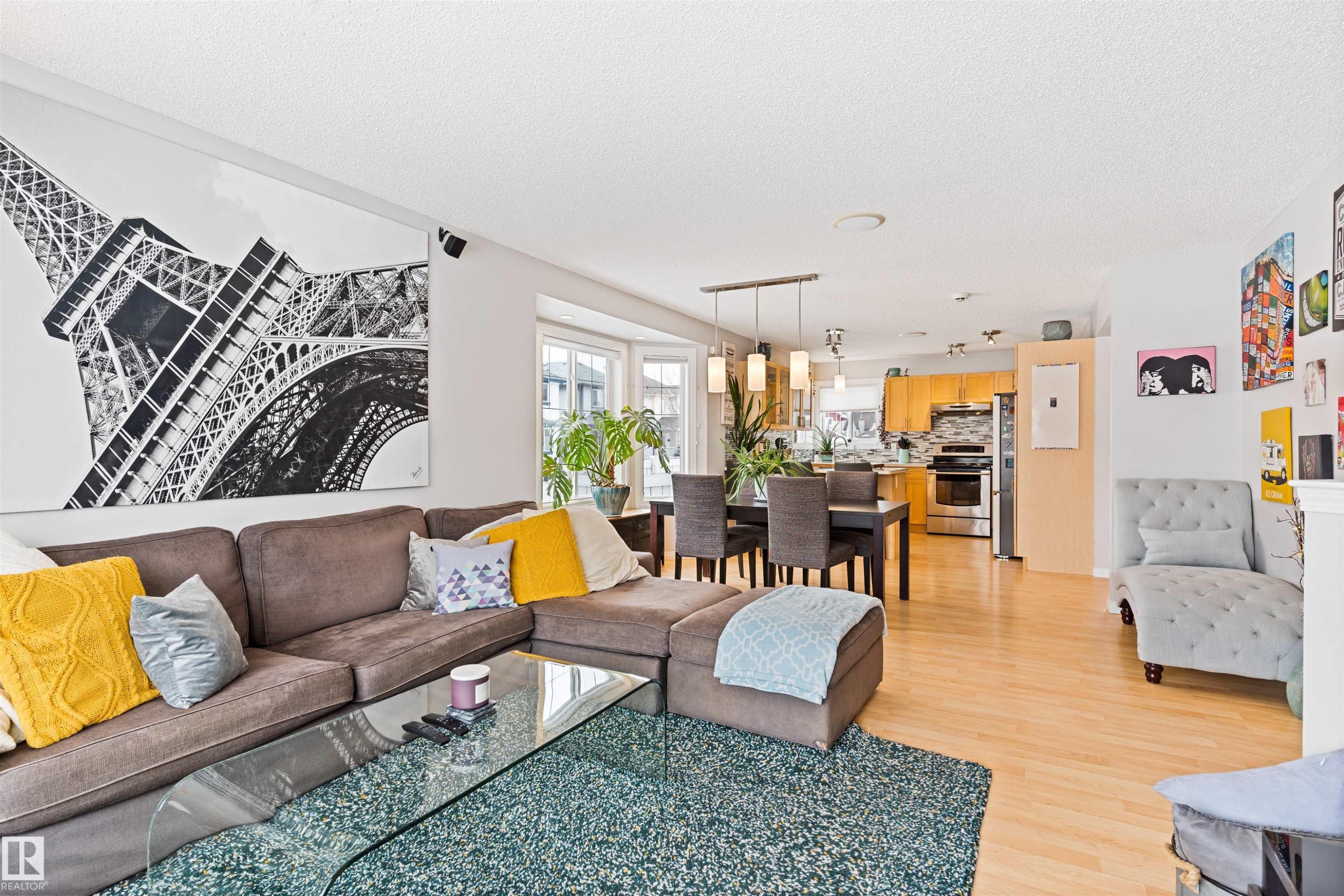 Living room featuring light wood-style floors and a textured ceiling - 7804 Schmid Place, Edmonton, AB - Indoor Photo Showing Living Room