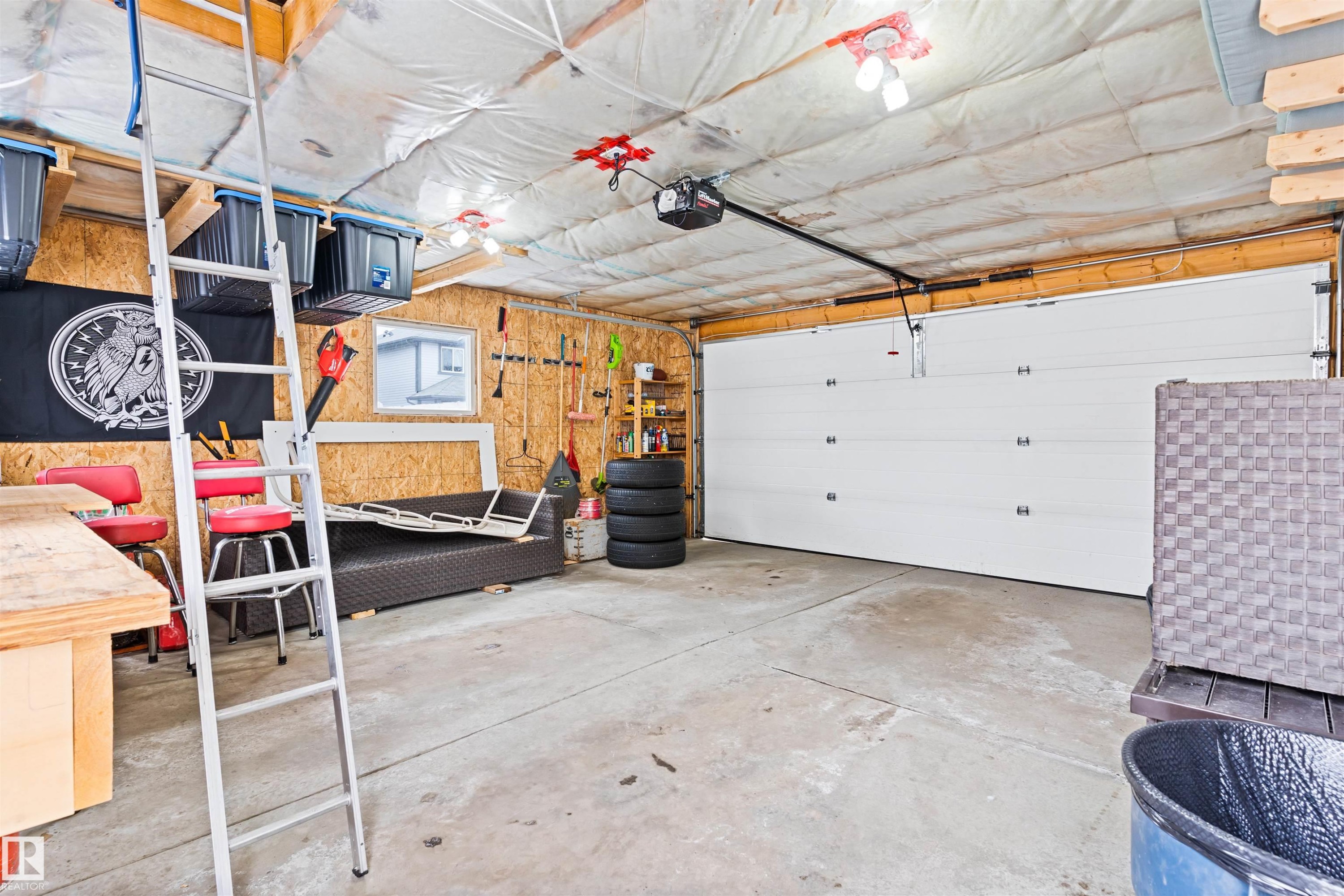 Garage featuring a garage door opener - 7804 Schmid Place, Edmonton, AB - Indoor Photo Showing Garage