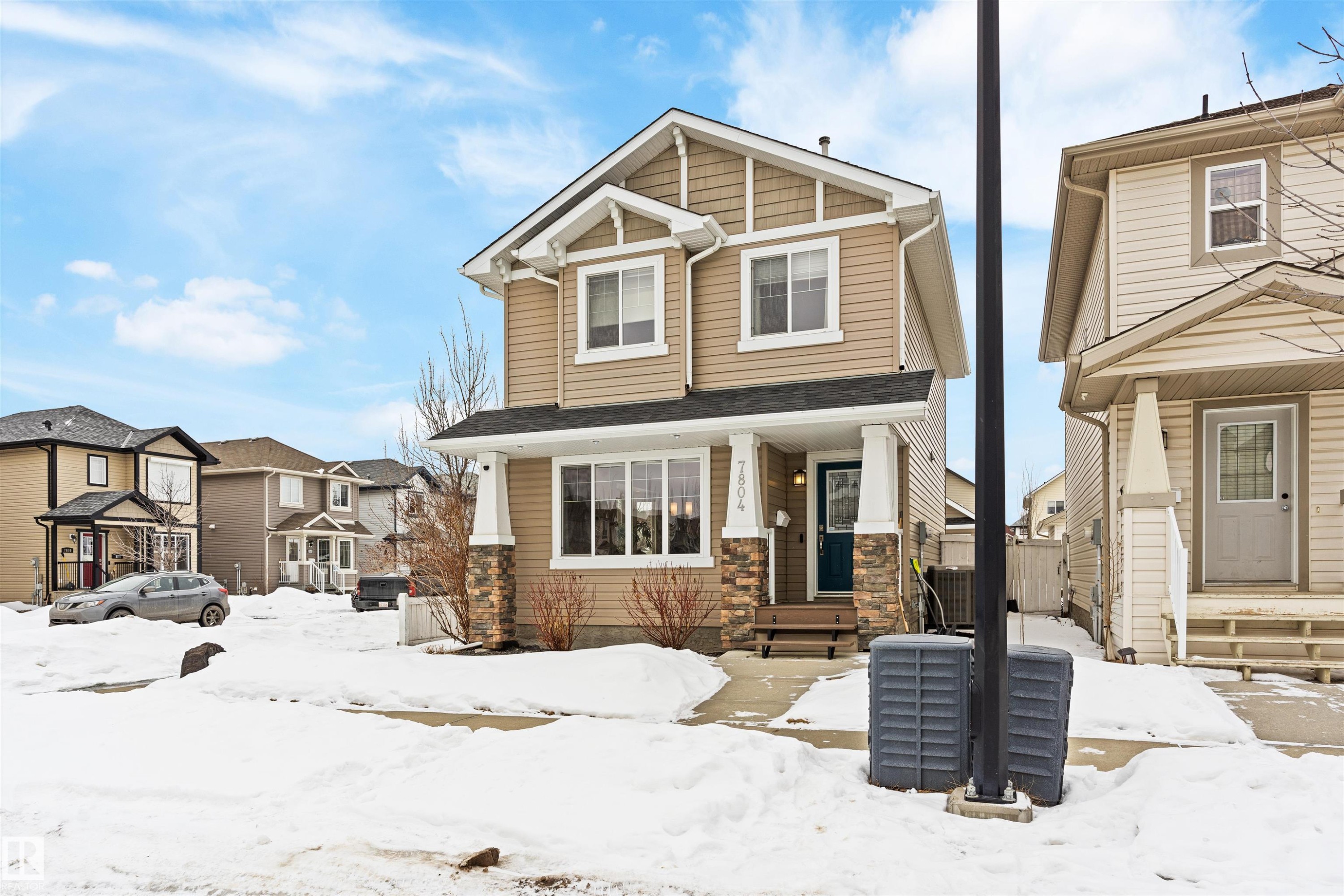 View of front of home featuring stone siding - 7804 Schmid Place, Edmonton, AB - Outdoor With Facade