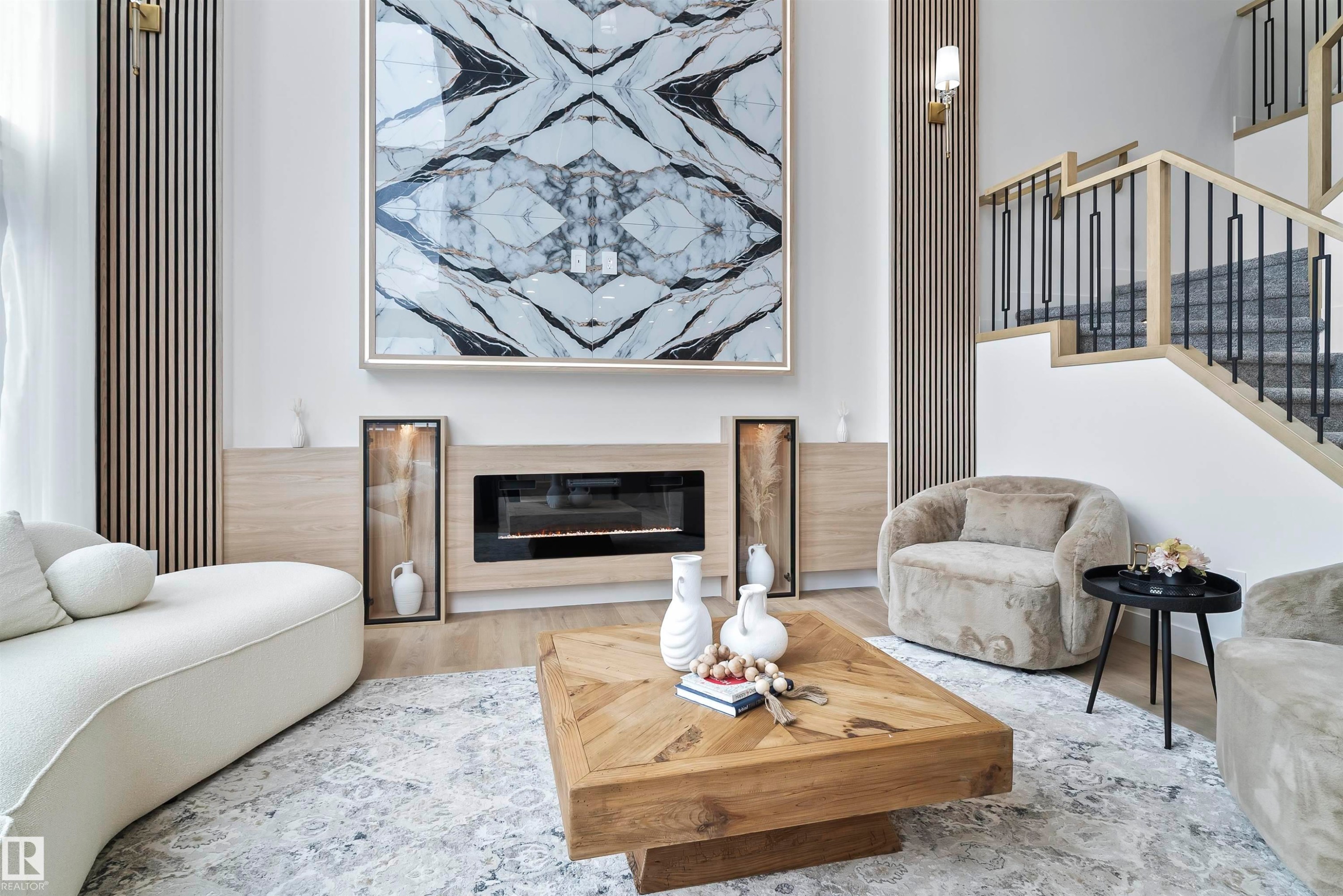 Living room with a glass covered fireplace and wood finished floors - 13152 187 Avenue, Edmonton, AB - Indoor Photo Showing Living Room With Fireplace