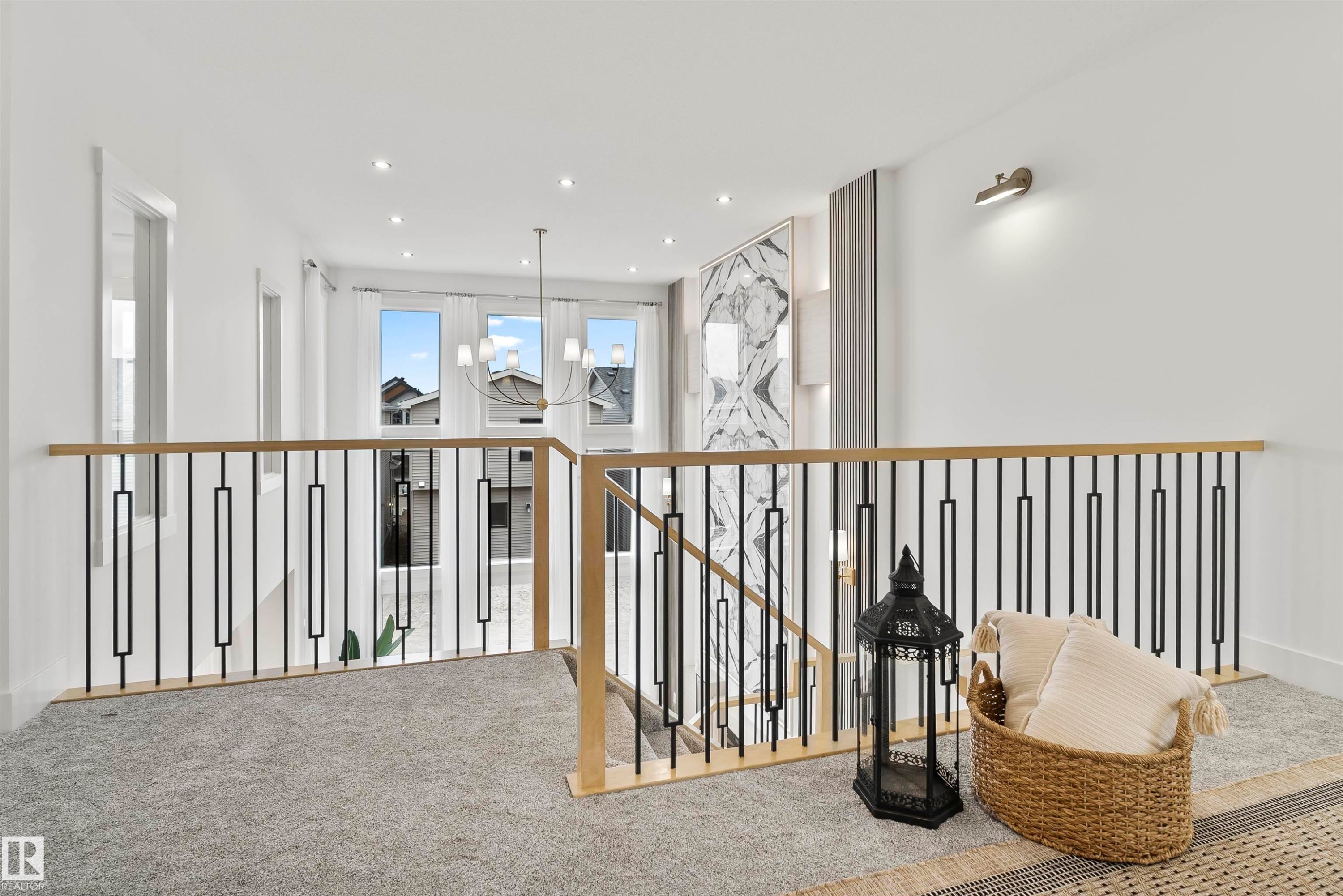 Hallway with carpet flooring, hanging lights, and an upstairs landing - 13152 187 Avenue, Edmonton, AB - Indoor Photo Showing Other Room
