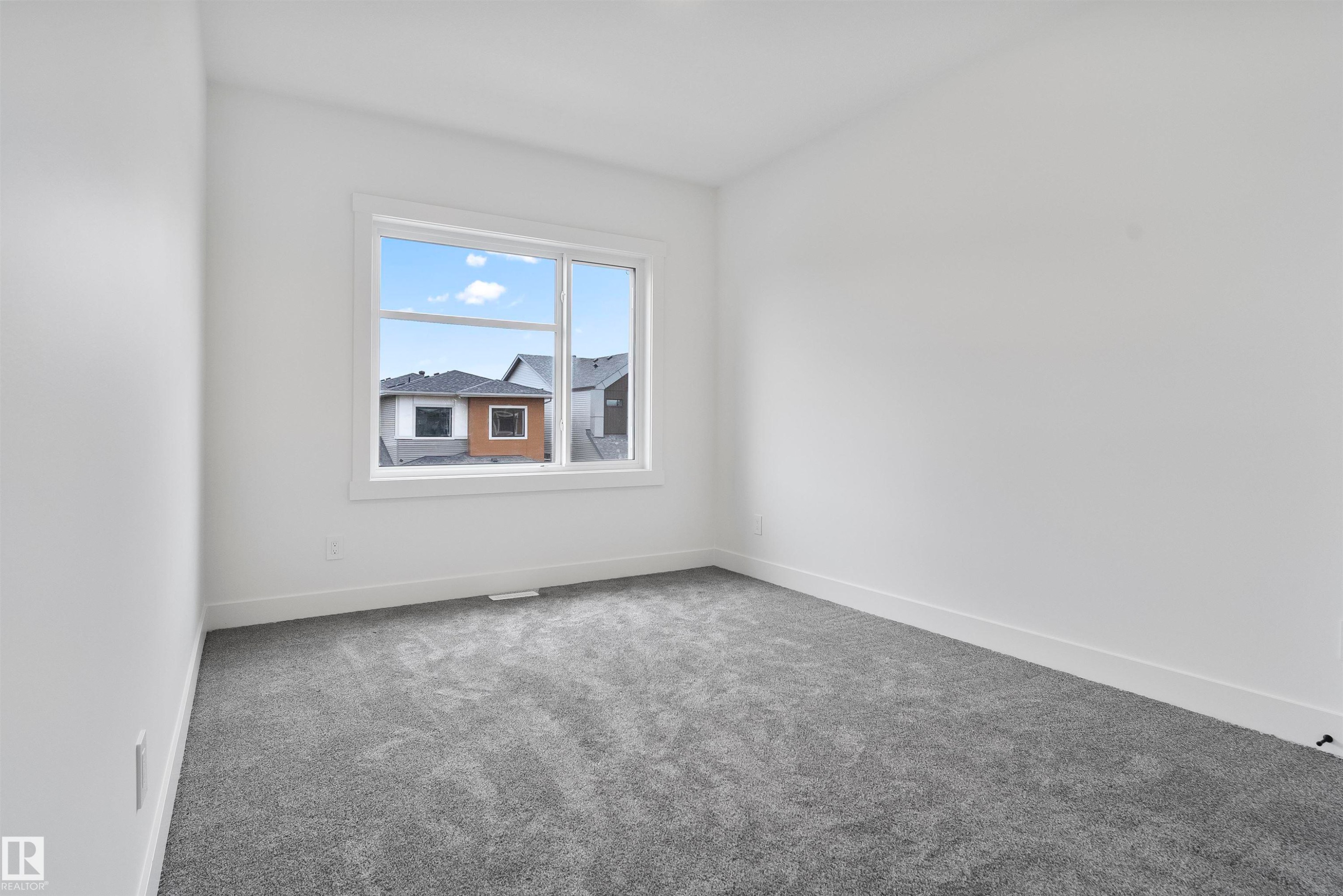 Carpeted empty room with baseboards - 13152 187 Avenue, Edmonton, AB - Indoor Photo Showing Other Room
