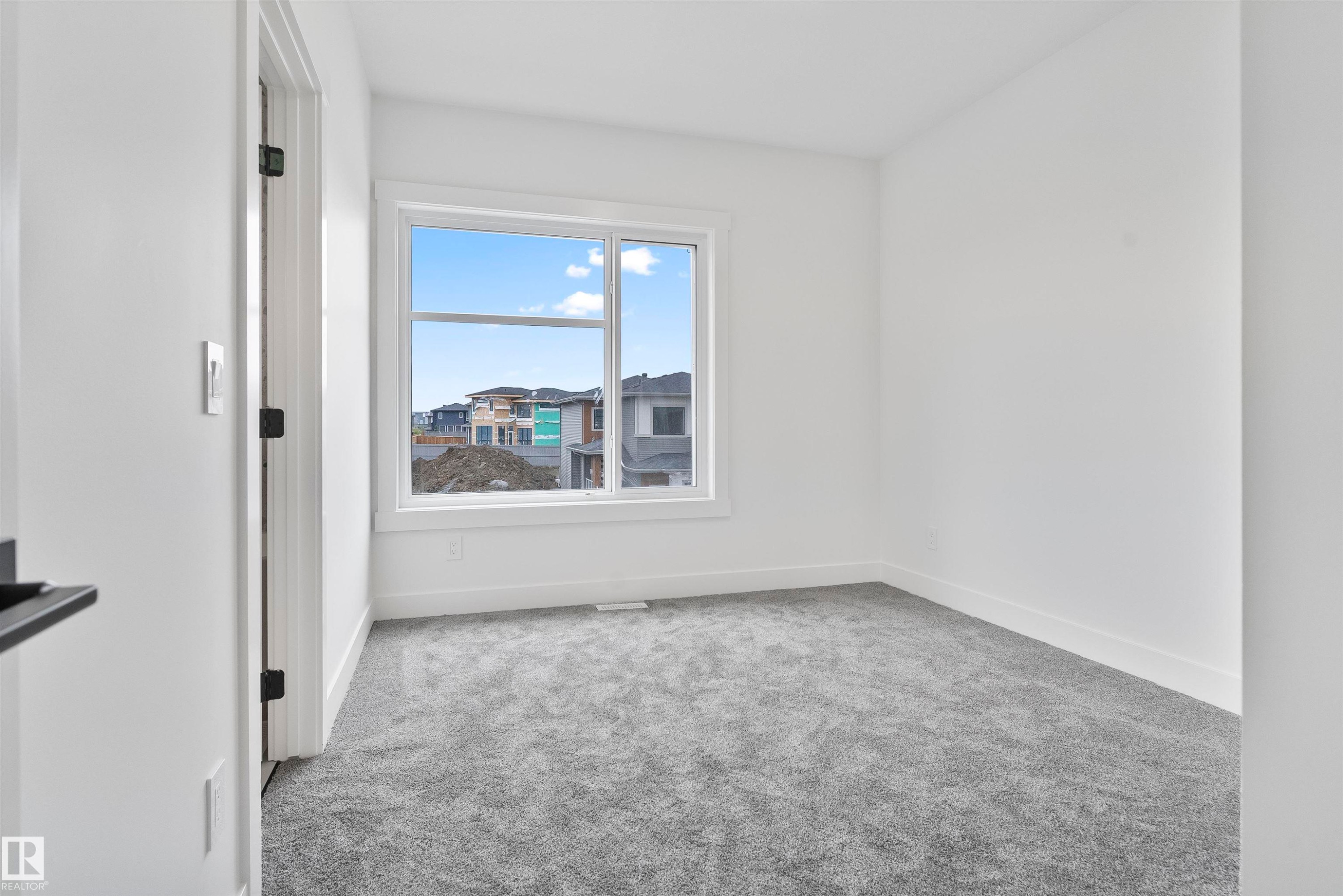 Unfurnished room with light colored carpet and baseboards - 13152 187 Avenue, Edmonton, AB - Indoor Photo Showing Other Room