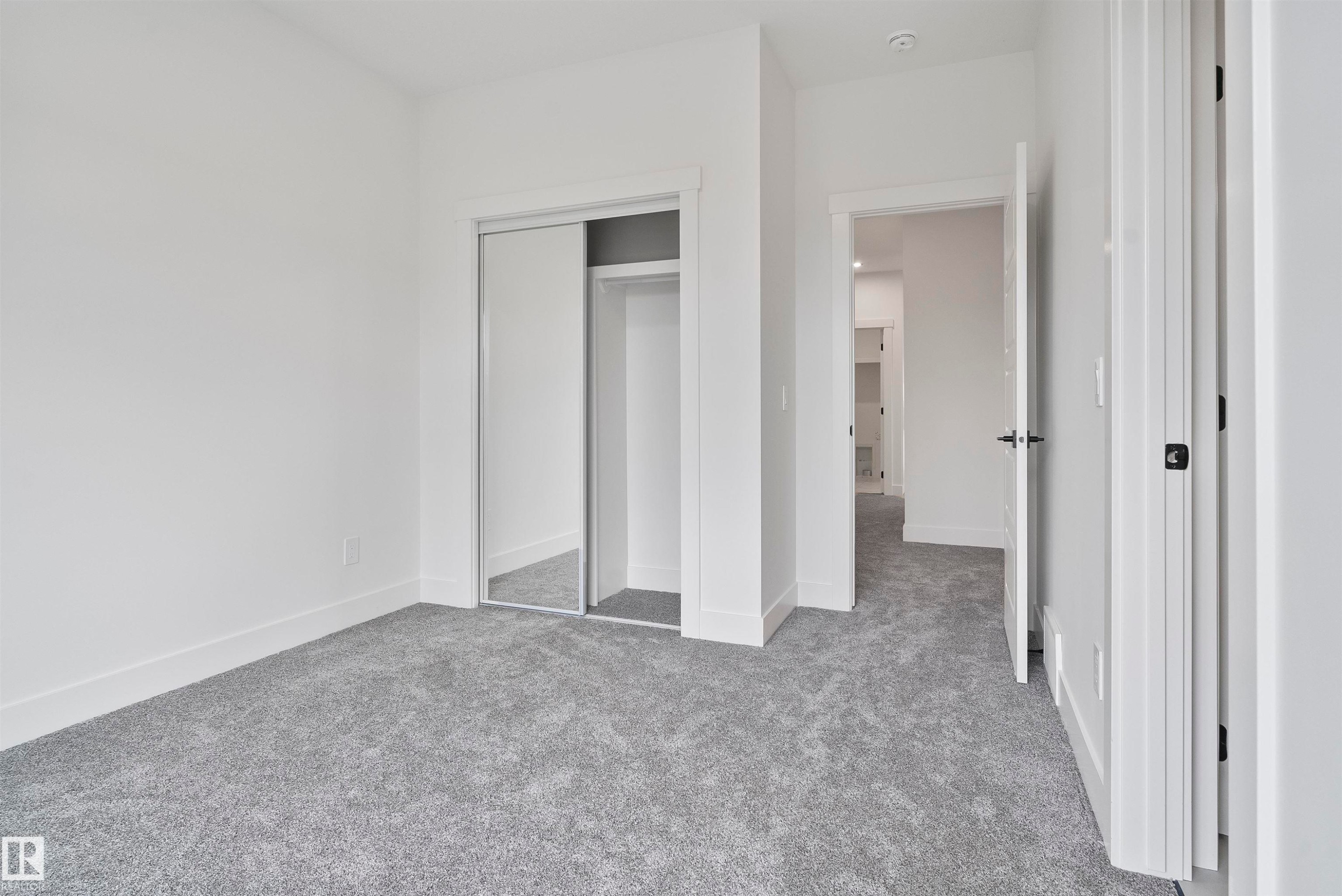 Unfurnished bedroom featuring carpet floors and a closet - 13152 187 Avenue, Edmonton, AB - Indoor Photo Showing Other Room