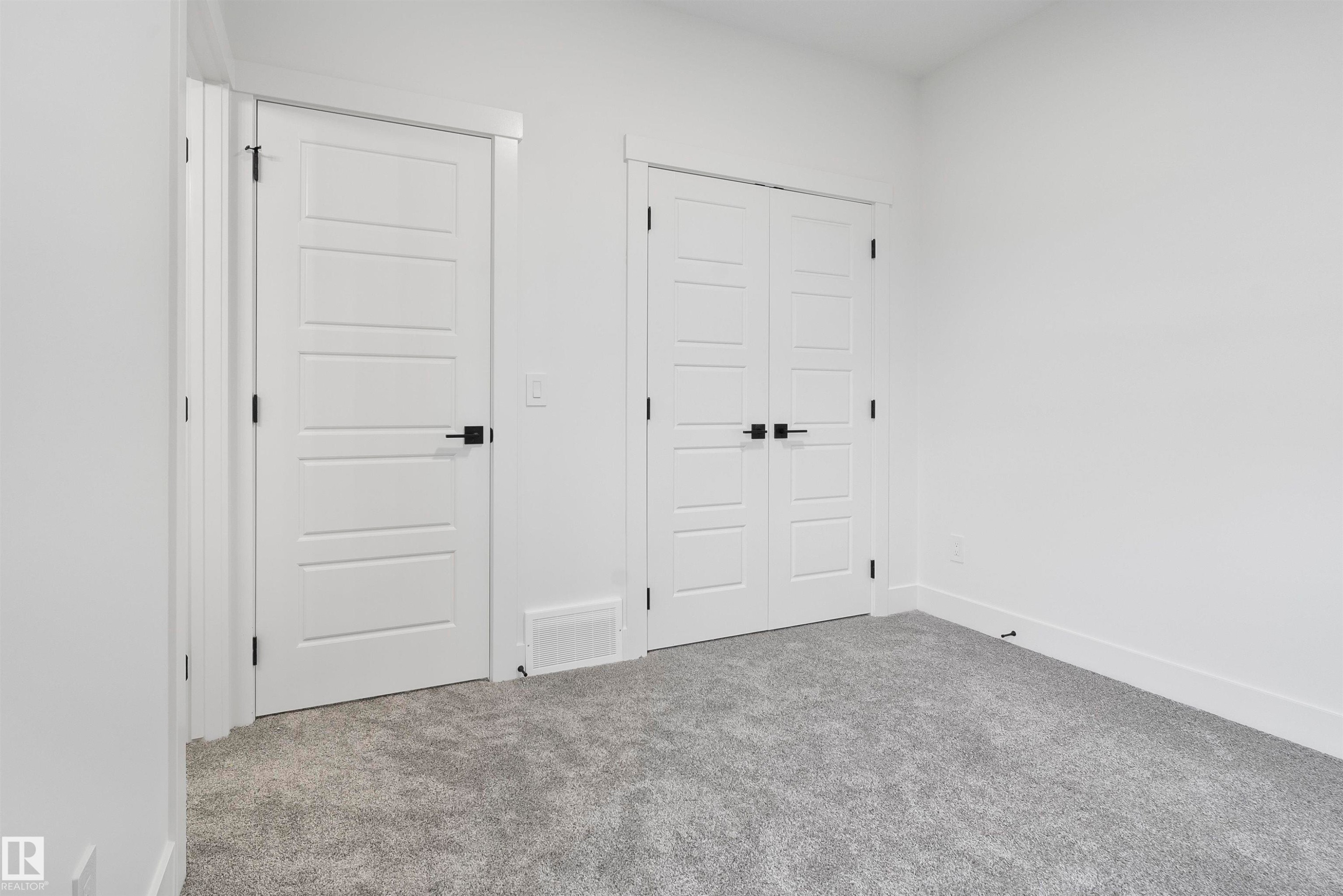 Unfurnished bedroom featuring carpet flooring and a closet - 13152 187 Avenue, Edmonton, AB - Indoor Photo Showing Other Room