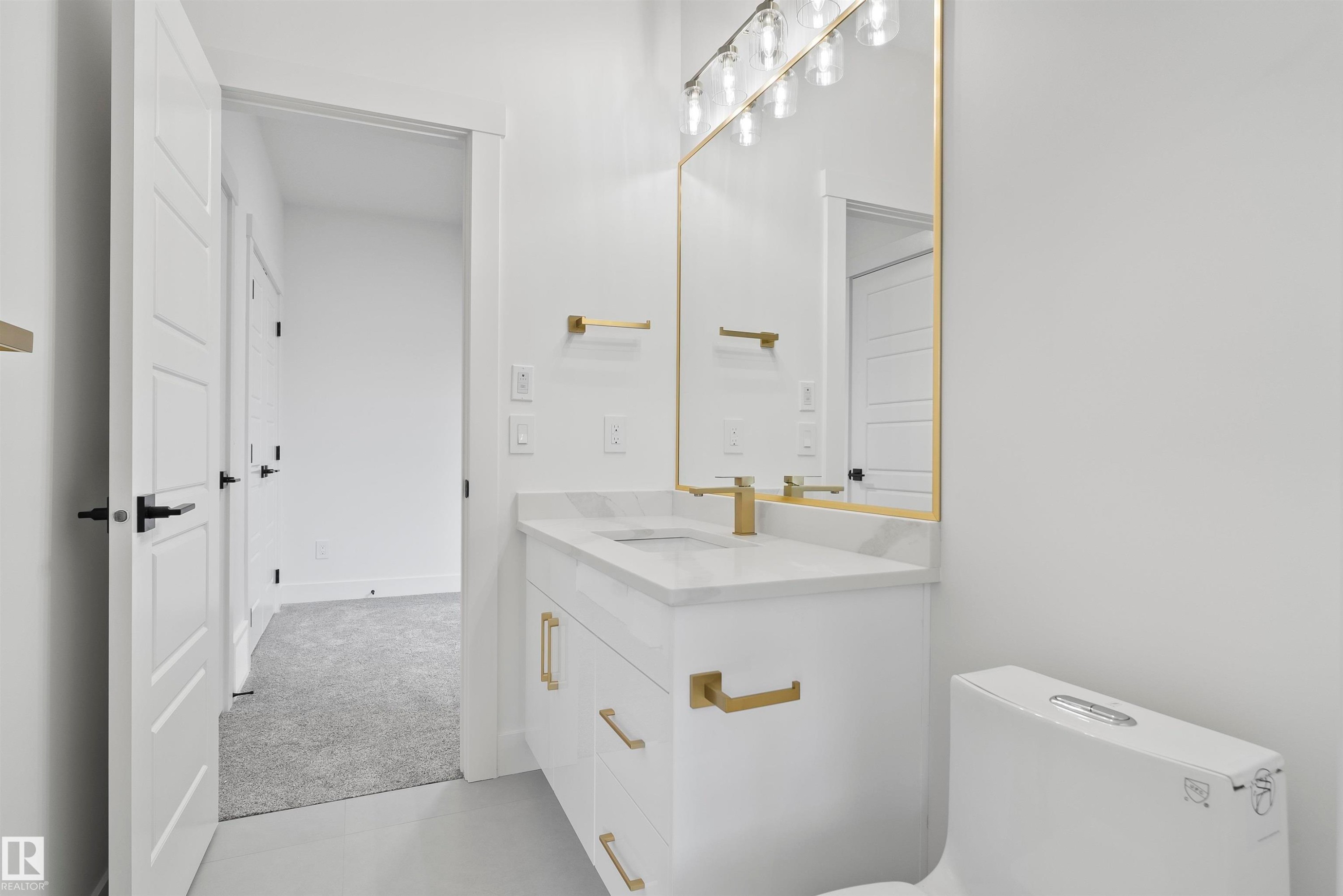 Half bath featuring vanity and light colored carpet - 13152 187 Avenue, Edmonton, AB - Indoor Photo Showing Bathroom