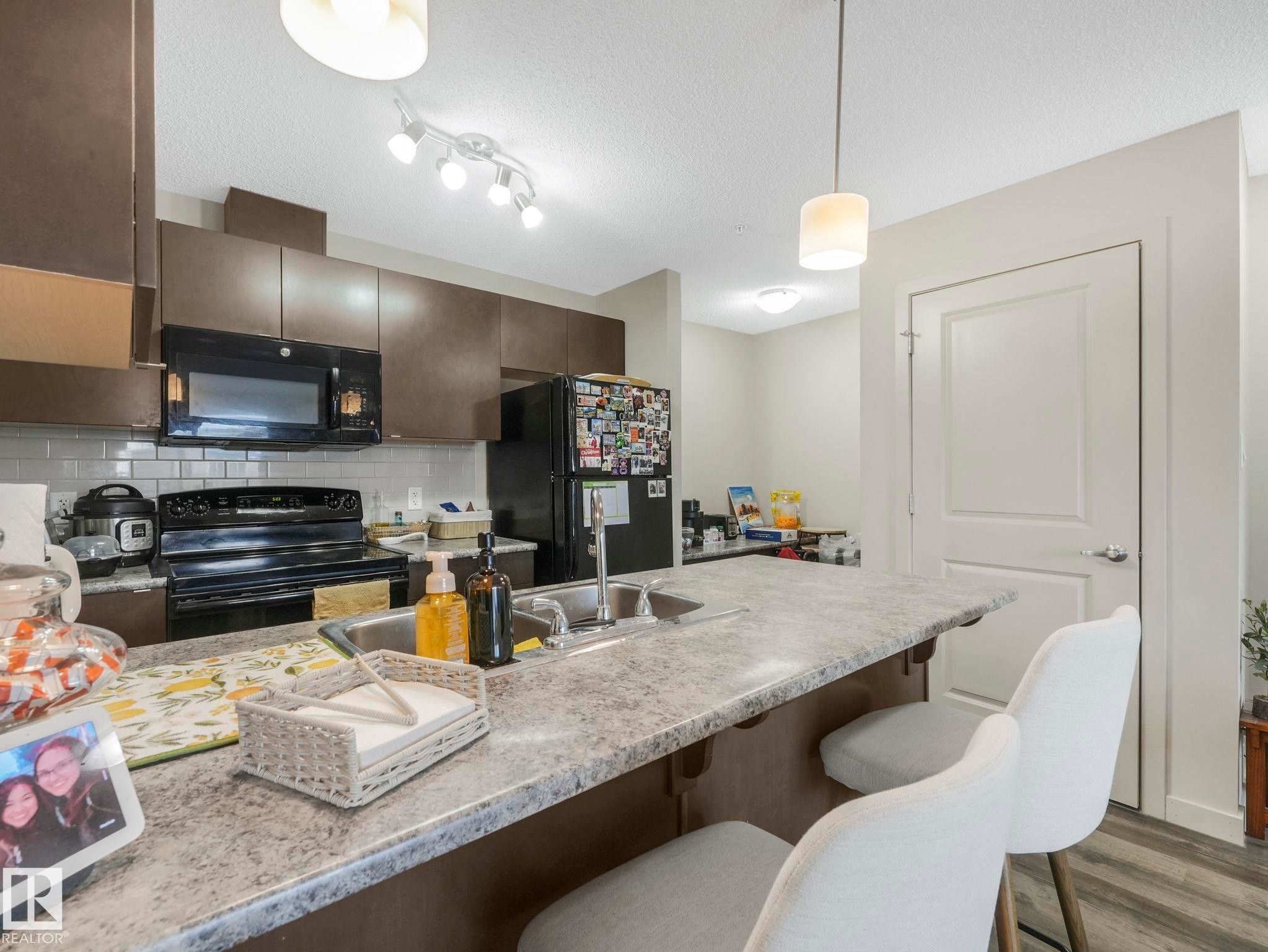 212 508 Albany Way, Edmonton, AB - Indoor Photo Showing Kitchen With Double Sink