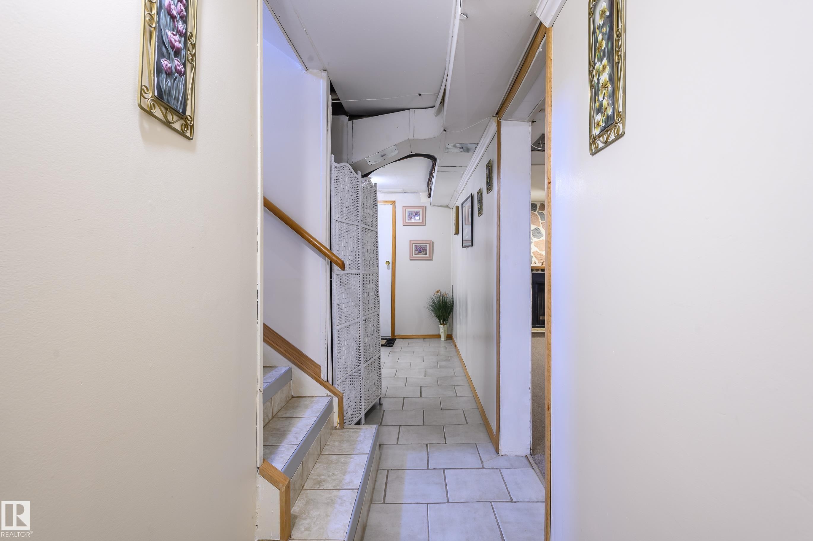 Hall featuring stairs and light tile patterned floors - 13420 113A St, Edmonton, AB - Indoor Photo Showing Other Room