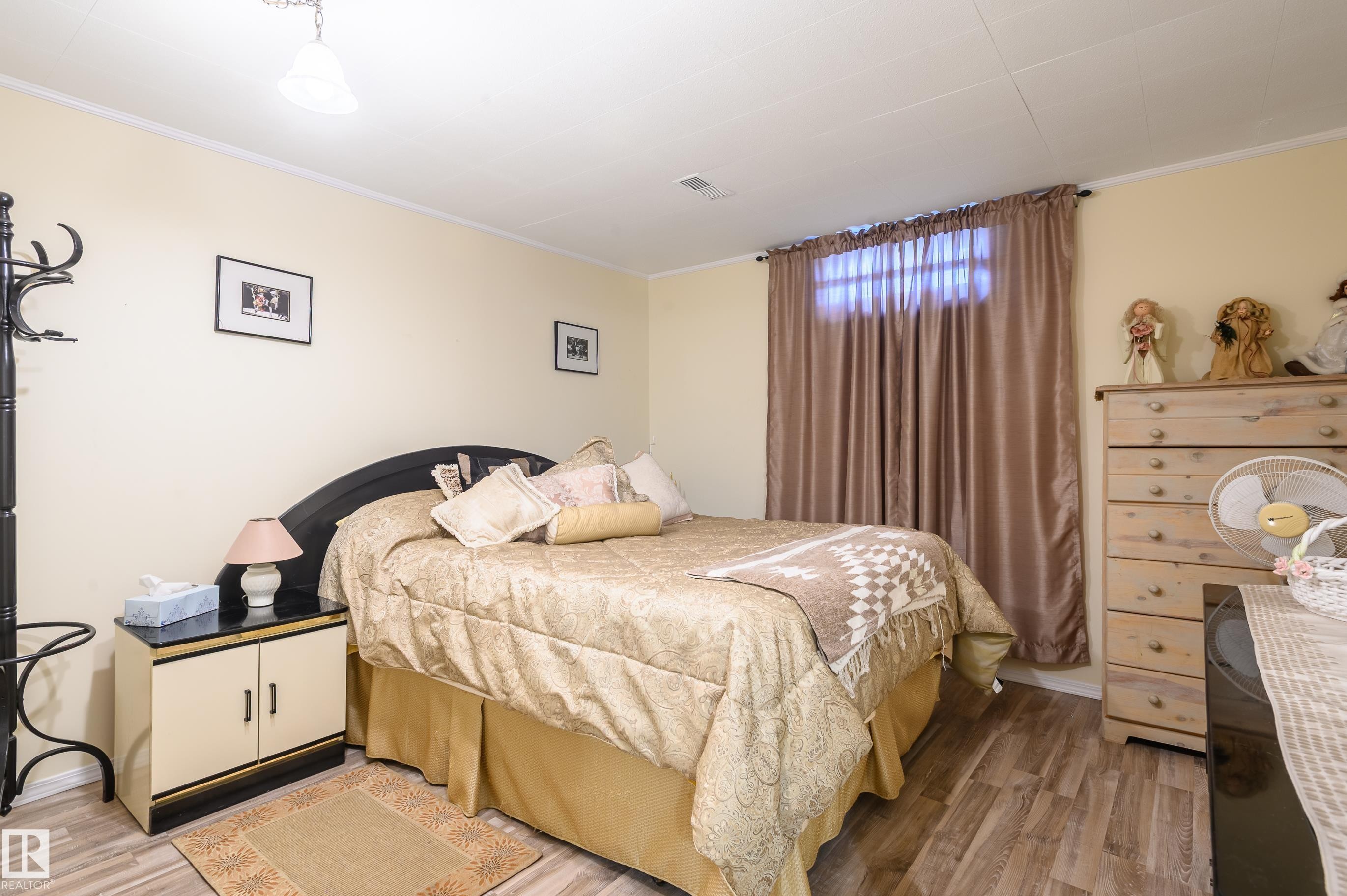 Bedroom with light wood-style flooring and crown molding - 13420 113A St, Edmonton, AB - Indoor Photo Showing Bedroom