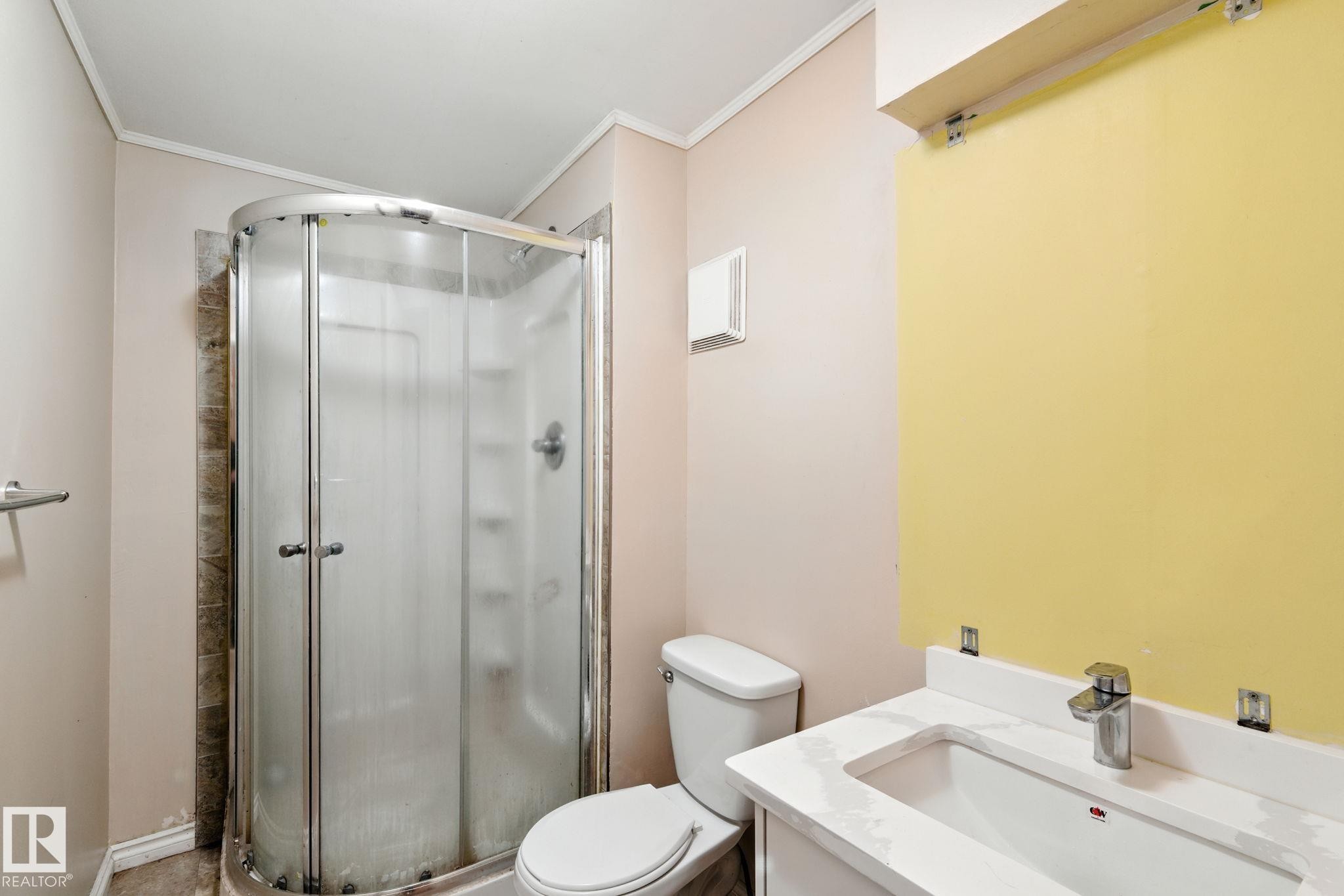 Full bath with vanity, a shower stall, and crown molding - 7836 7 Avenue, Edmonton, AB - Indoor Photo Showing Bathroom
