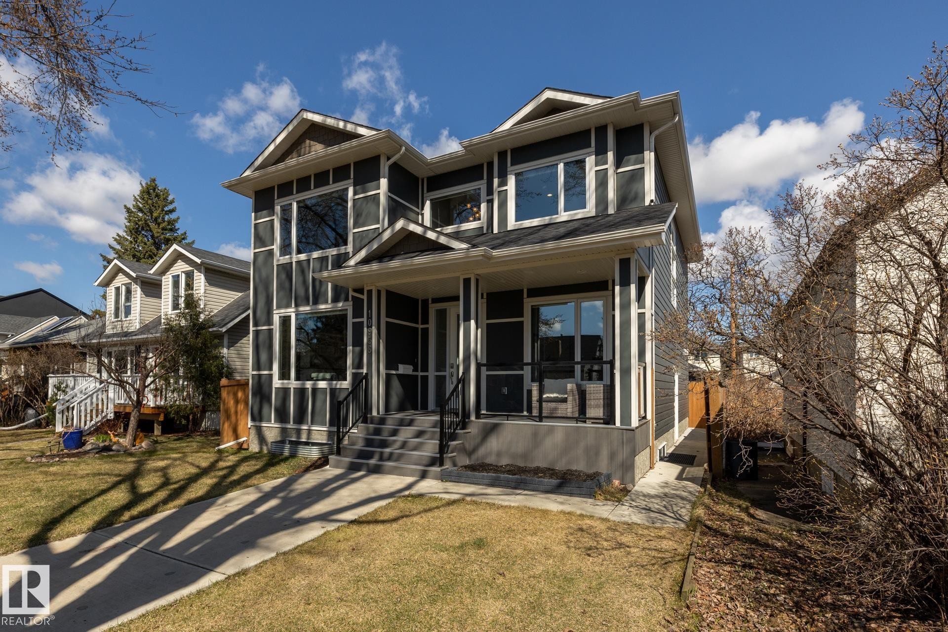 View of front of house with a sunroom and a front lawn - 10936 71 Avenue, Edmonton, AB - Outdoor