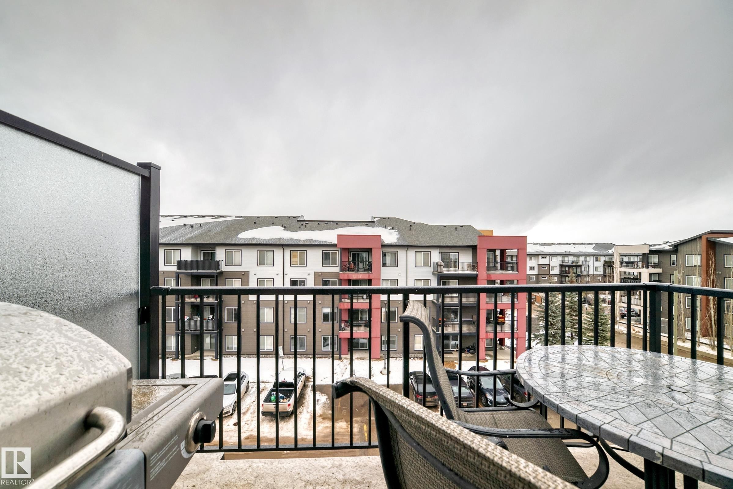 Balcony featuring outdoor dining area and a residential view - 403 340 Windermere Road, Edmonton, AB - Outdoor With Exterior