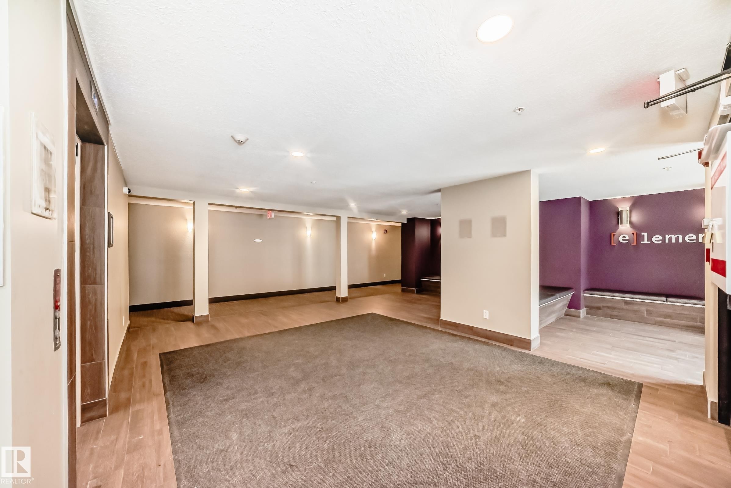 Finished below grade area with light wood finished floors and recessed lighting - 403 340 Windermere Road, Edmonton, AB - Indoor Photo Showing Other Room