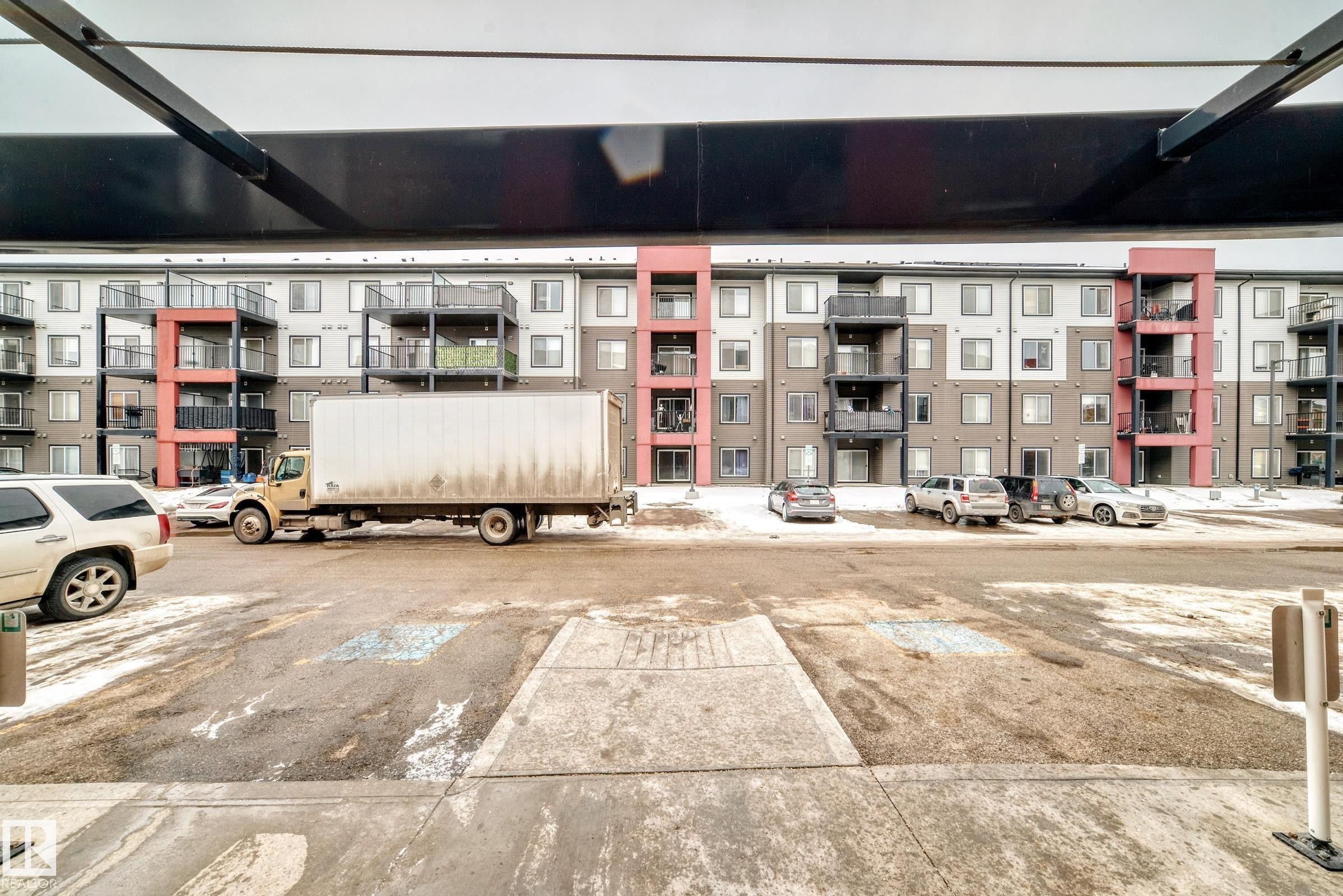 View of apartment building / complex with uncovered parking - 403 340 Windermere Road, Edmonton, AB - Outdoor With Facade
