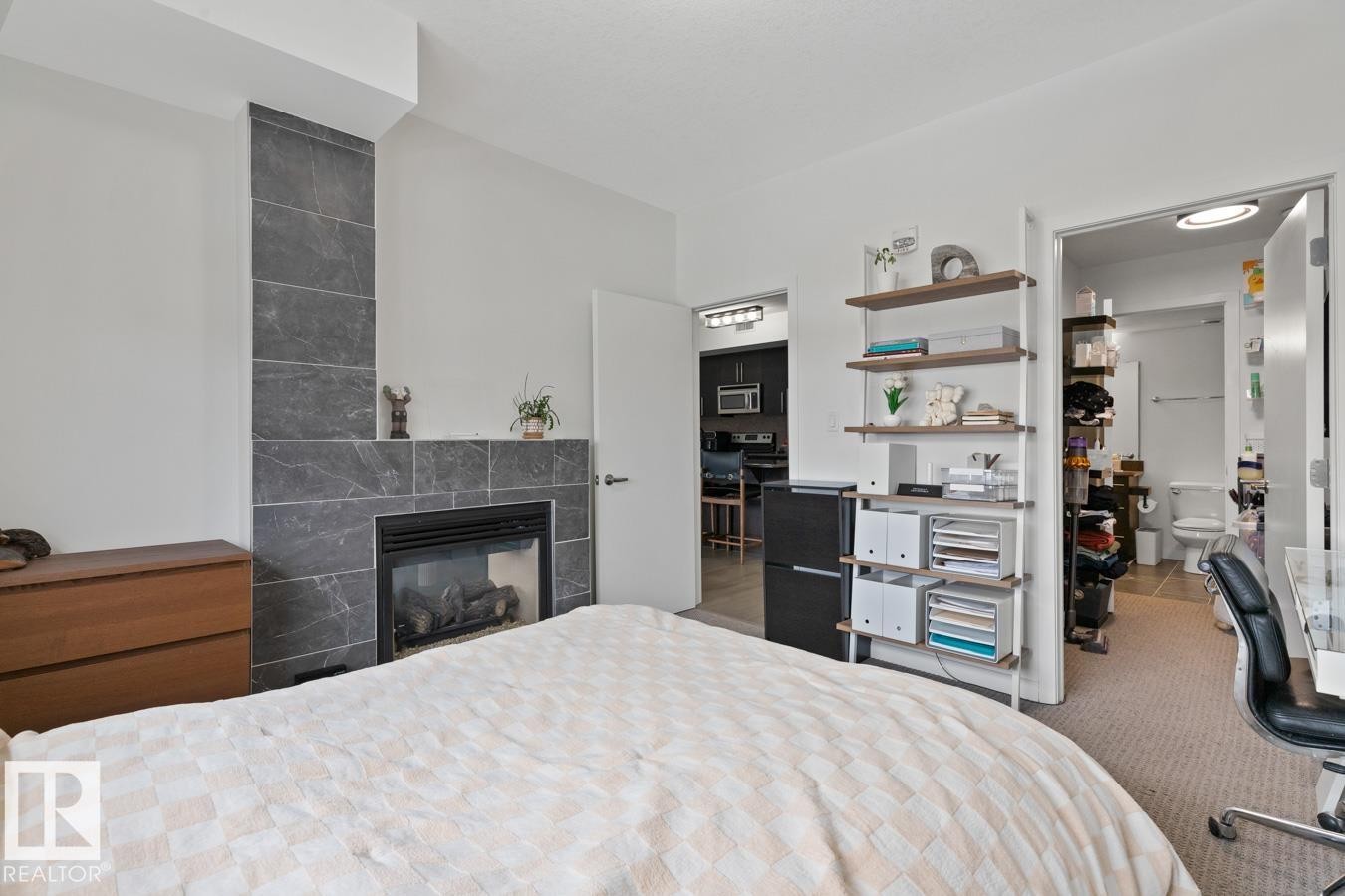 408 11203 103A Avenue, Edmonton, AB - Indoor Photo Showing Bedroom With Fireplace