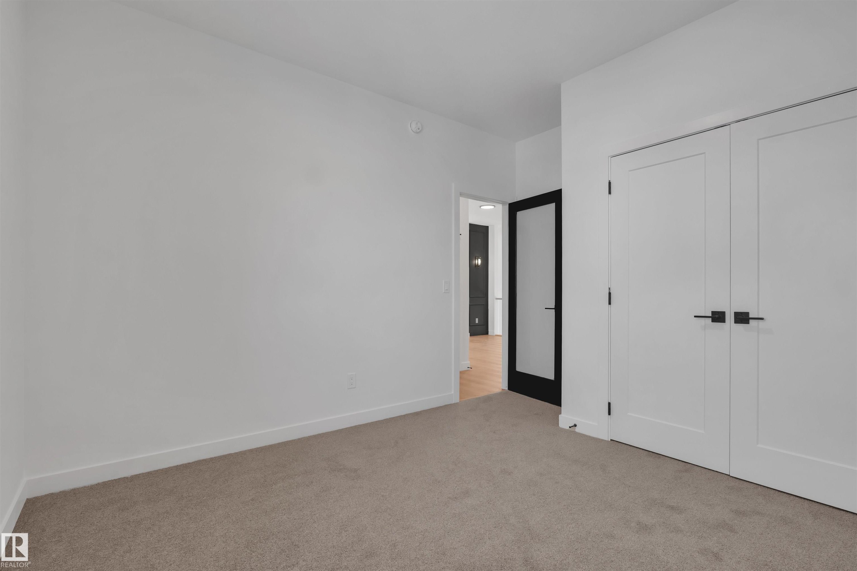 Unfurnished bedroom featuring light colored carpet and a closet - 34 Grayson Green, Stony Plain, AB - Indoor Photo Showing Other Room
