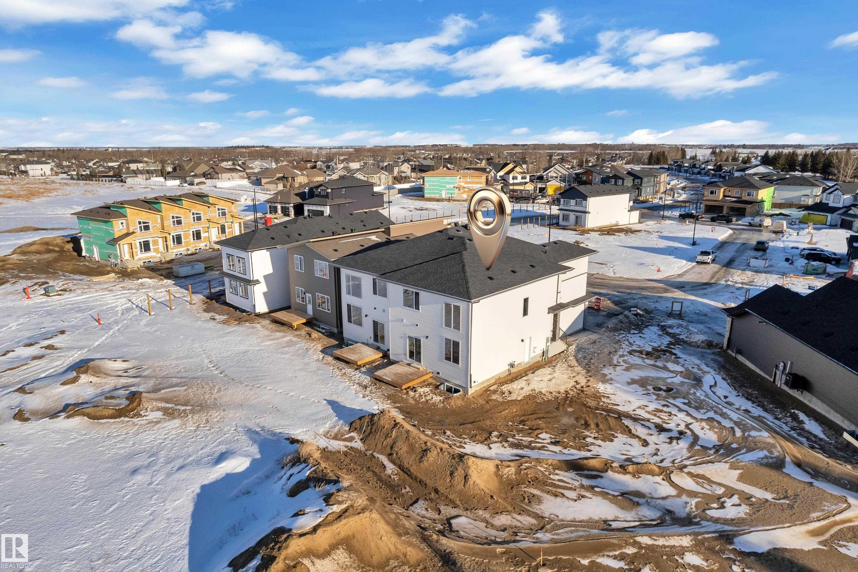 Snowy aerial view featuring a residential view - 34 Grayson Green, Stony Plain, AB - Outdoor With View