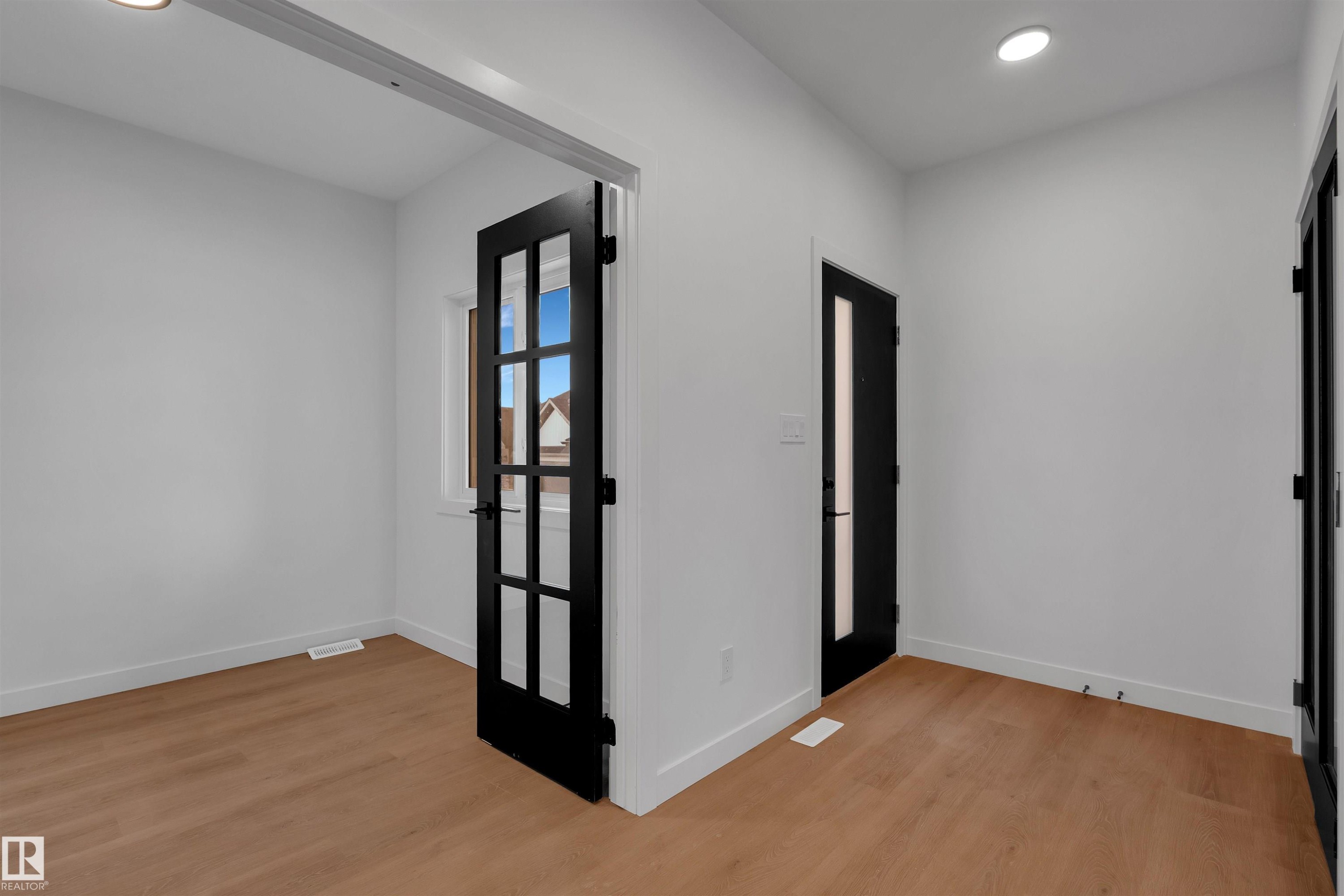 Empty room with recessed lighting and light wood finished floors - 34 Grayson Green, Stony Plain, AB - Indoor Photo Showing Other Room