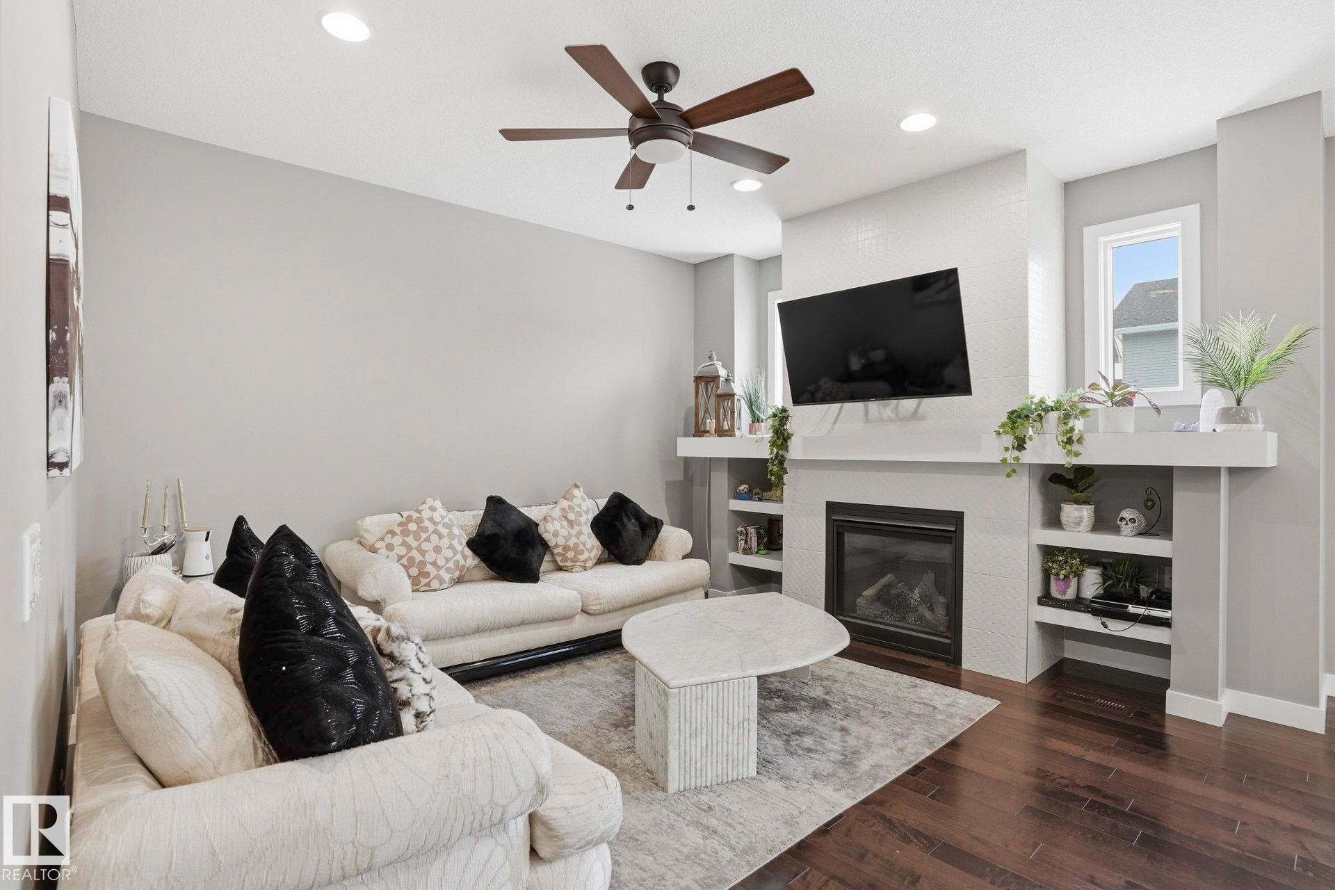 2236 Calhoun Link Link, Edmonton, AB - Indoor Photo Showing Living Room With Fireplace