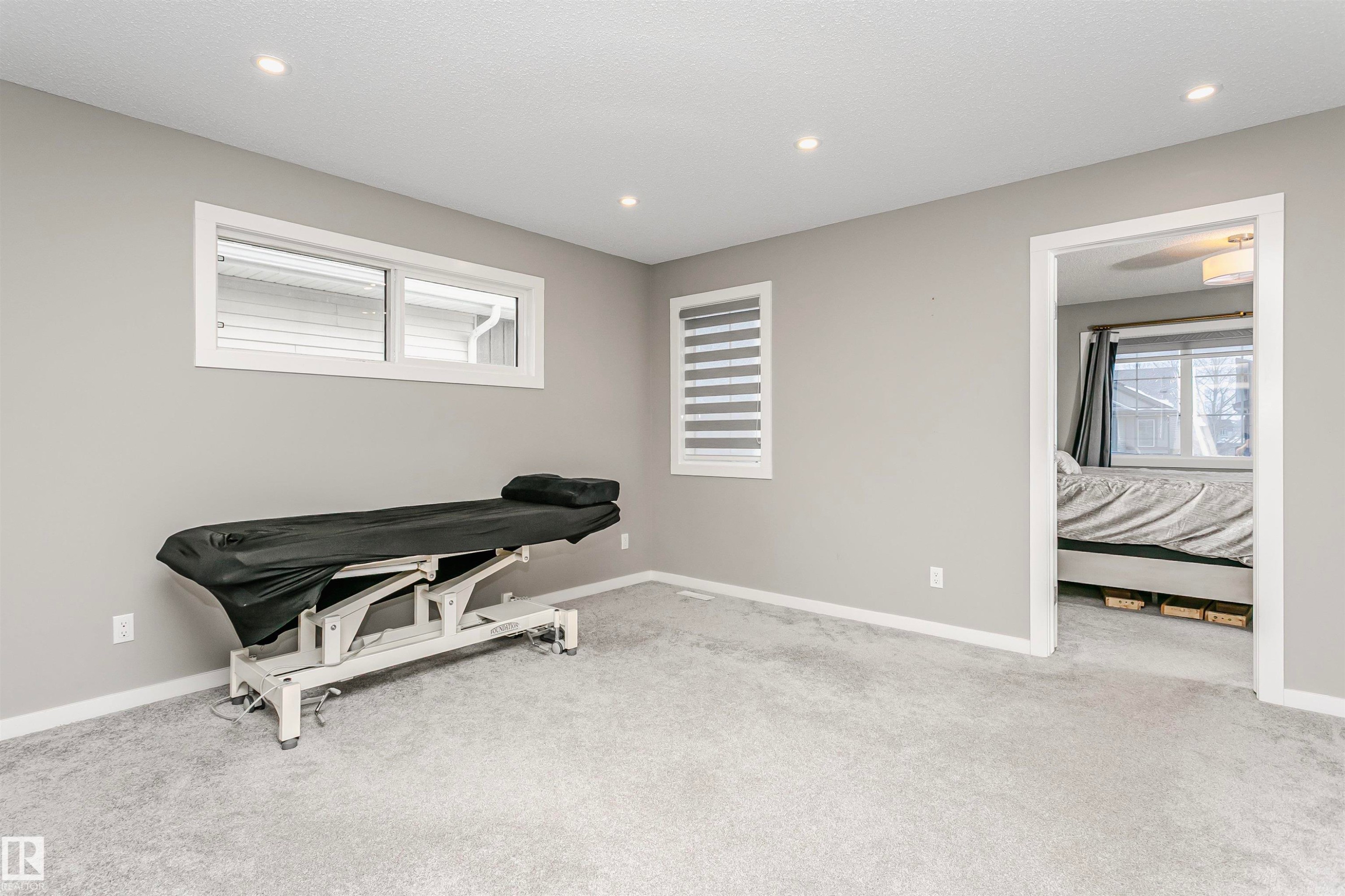 Sitting room with light colored carpet and recessed lighting - 7322 Chivers Crescent, Edmonton, AB - Indoor