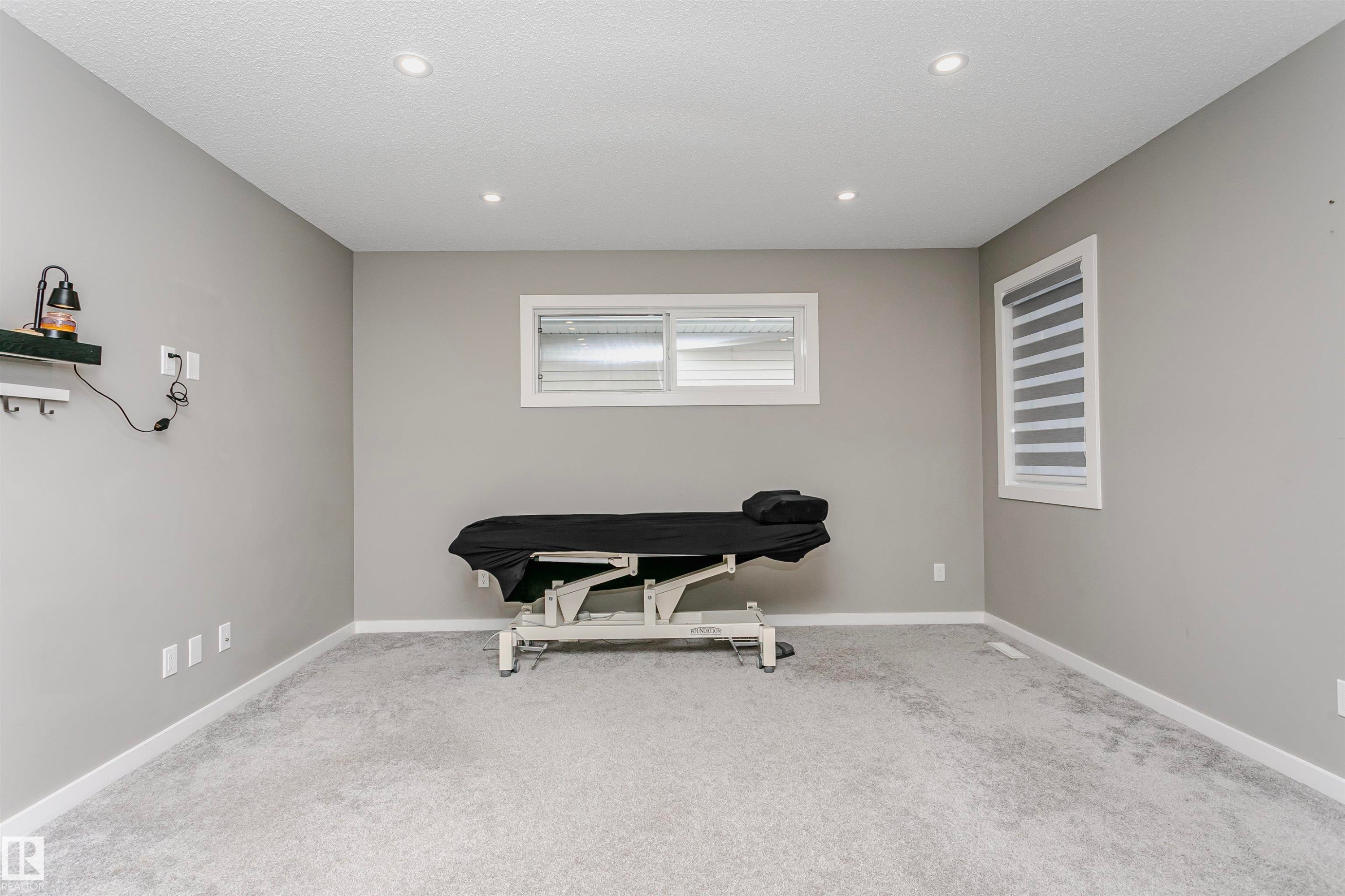 Living area with light colored carpet and recessed lighting - 7322 Chivers Crescent, Edmonton, AB - Indoor