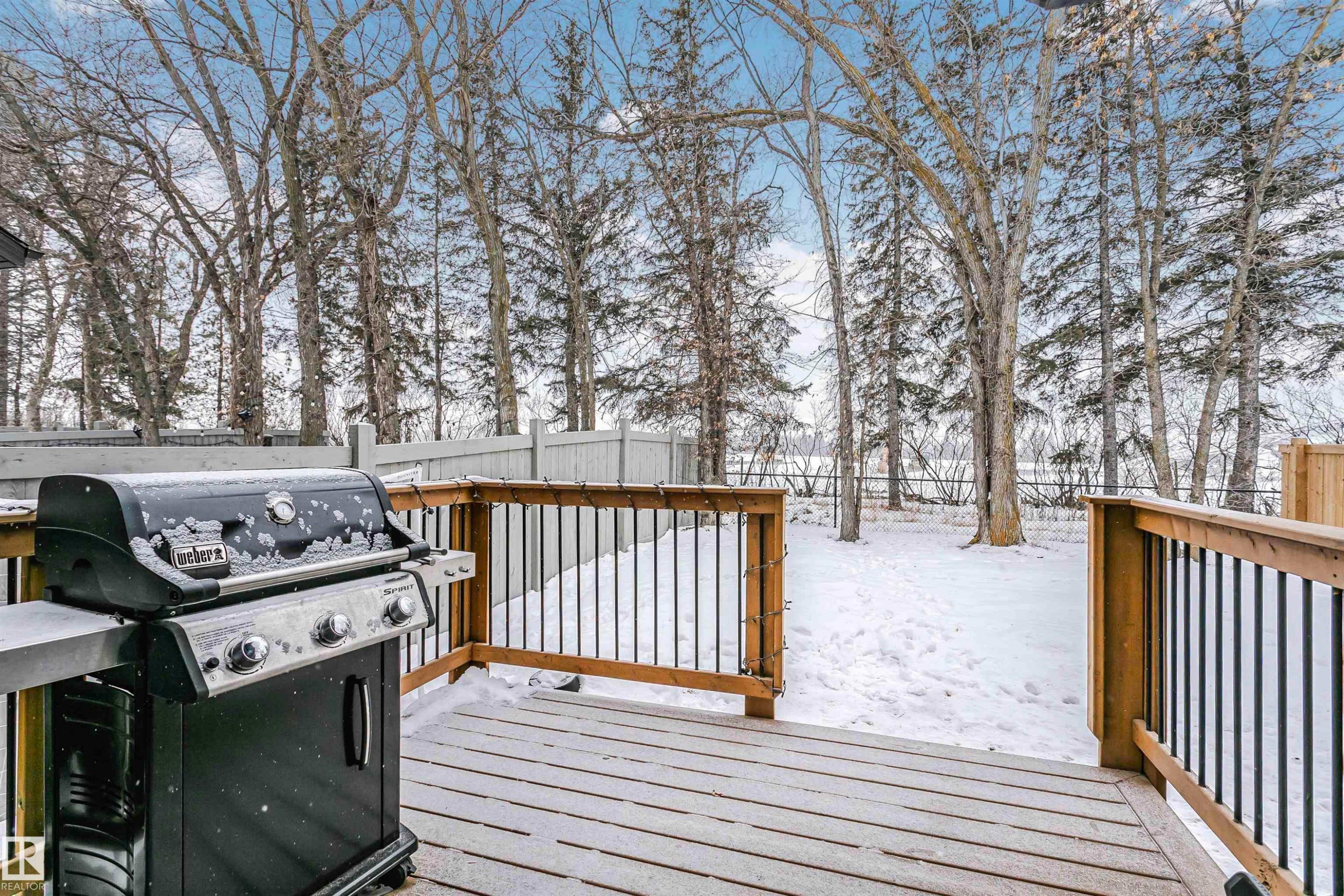 Snow covered deck featuring grilling area and a fenced backyard - 7322 Chivers Crescent, Edmonton, AB - Outdoor With Deck Patio Veranda